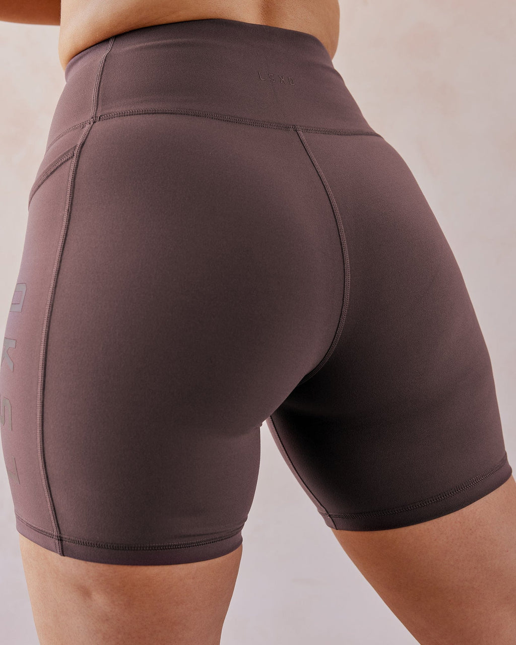 Model wearing Rep Mid Short Tight - Plum