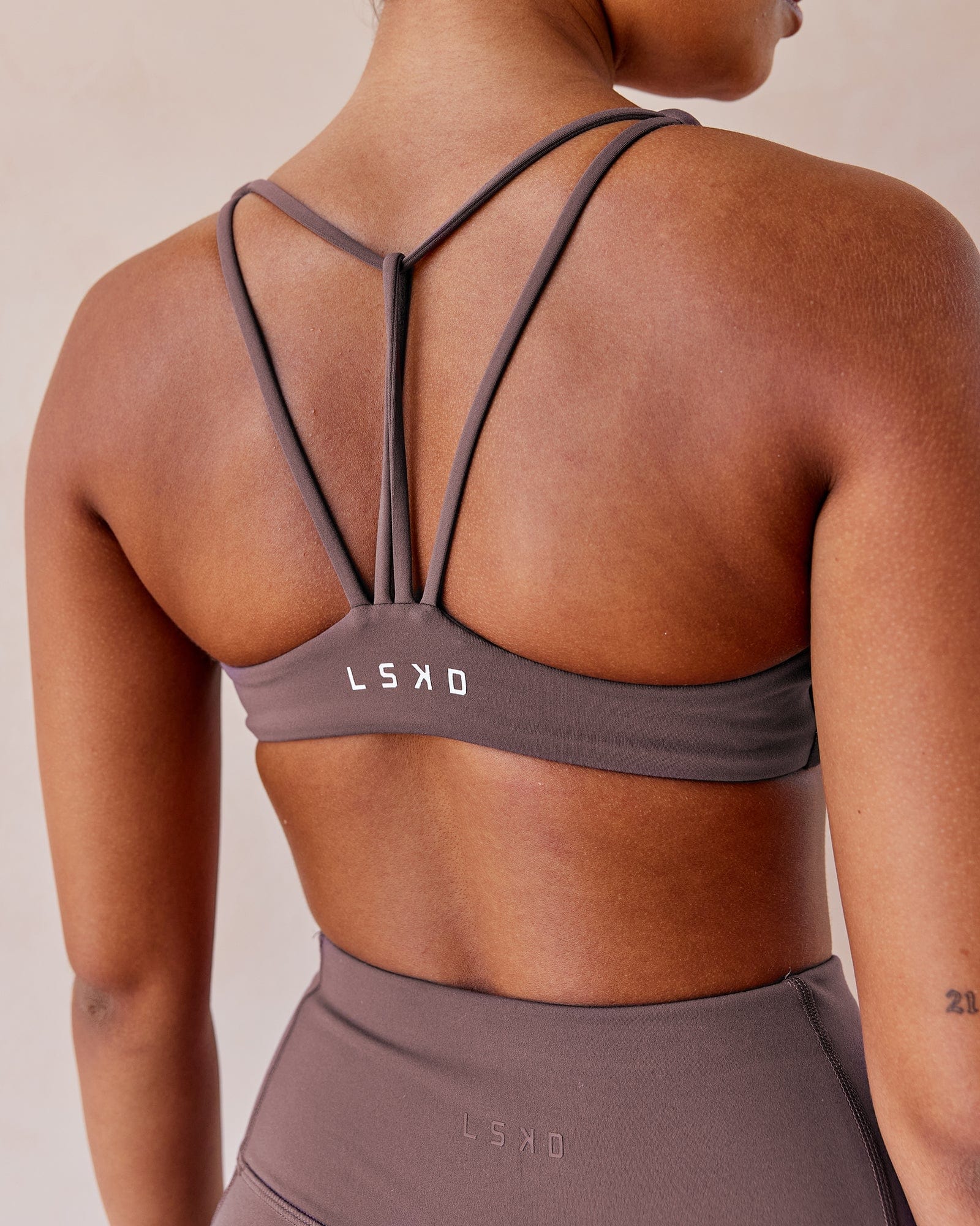 Model wearing Agile Sports Bra - Plum