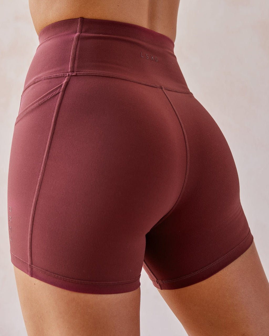 Model wearing Rep X-Short Tight - Apple Berry