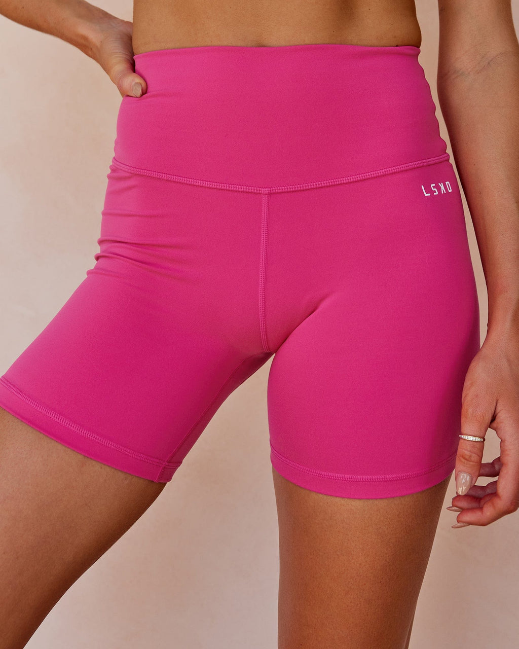 Model wearing Base Mid Short Tight - Magenta