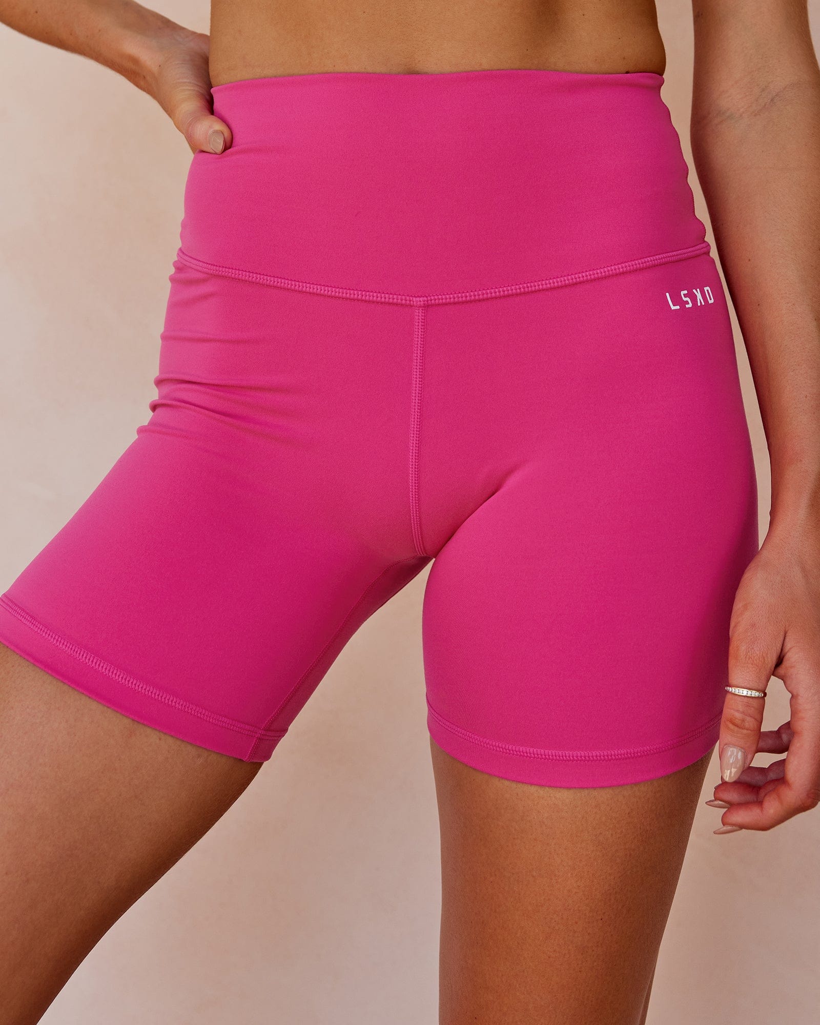 Model wearing Base Mid Short Tight - Magenta