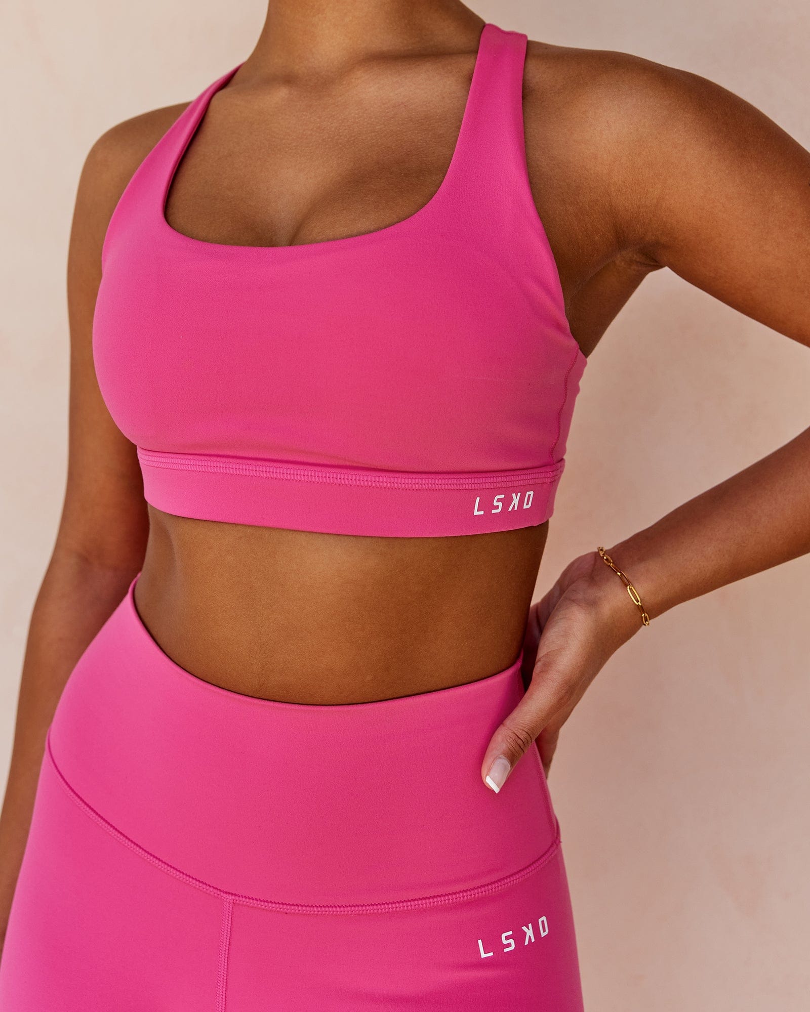 Model wearing Base Sports Bra - Magenta