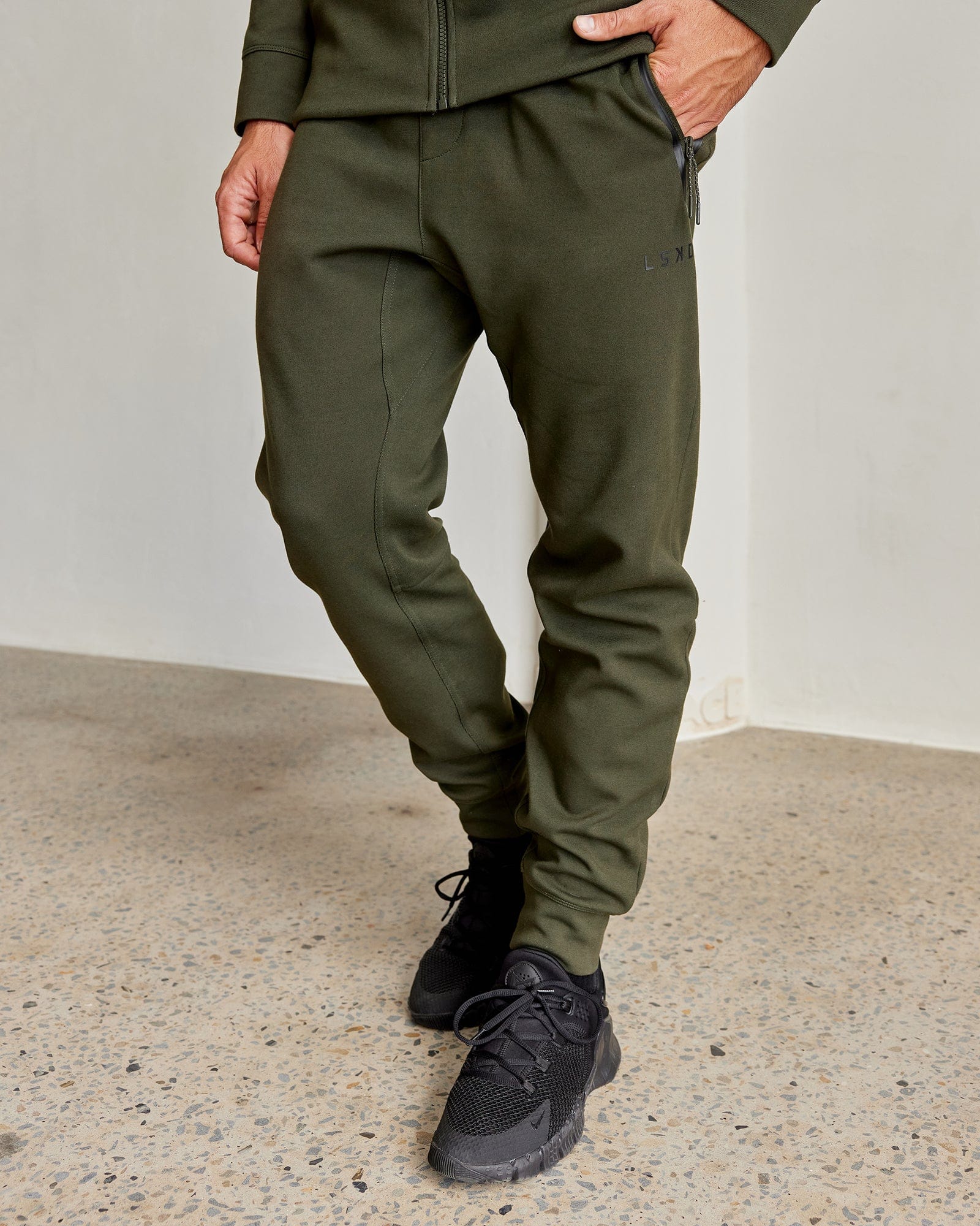 Model wearing Athlete ForgedFleece Zip Trackpant - Forest Night