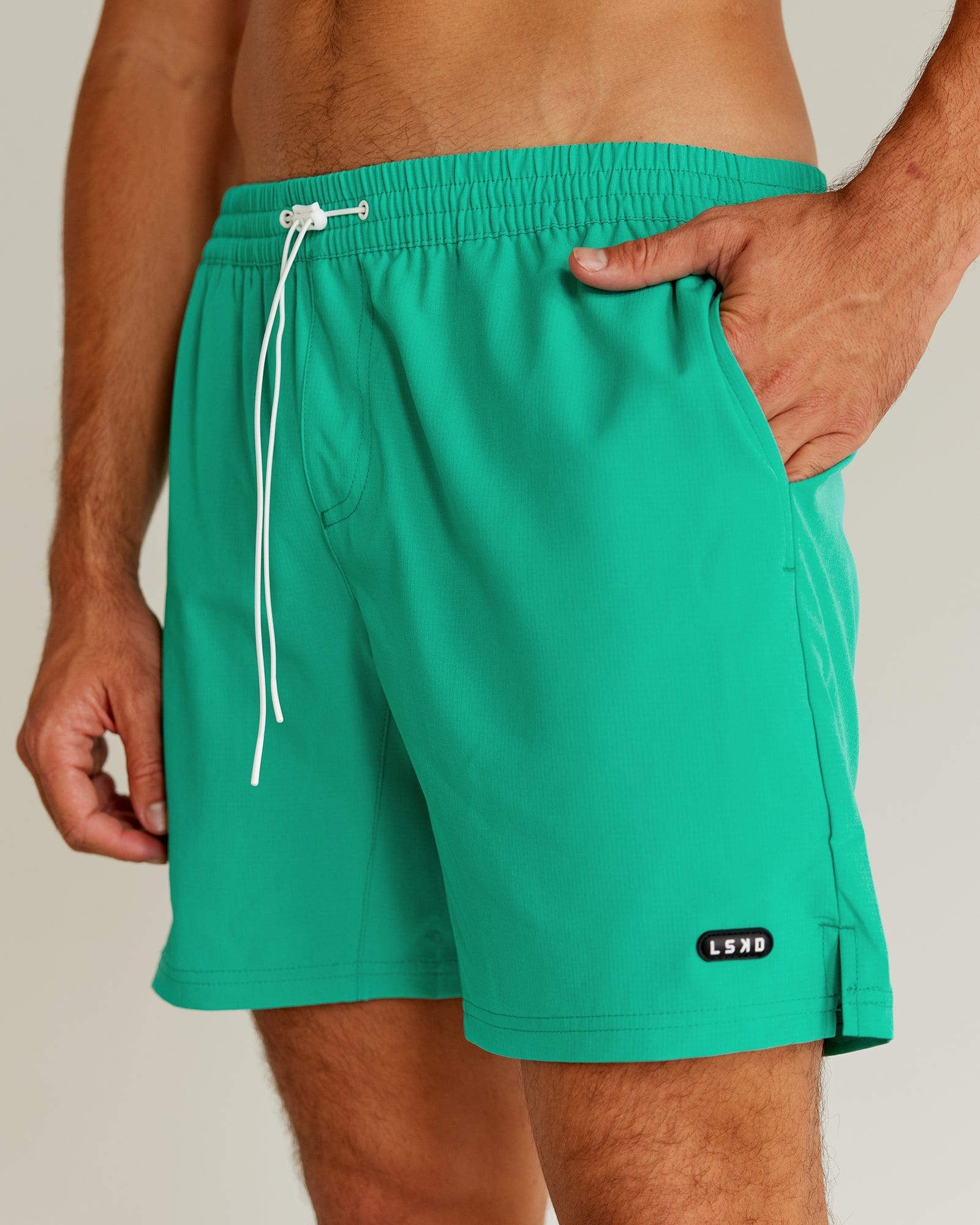 Model wearing Capsule 7" Performance Short - Hyper Teal