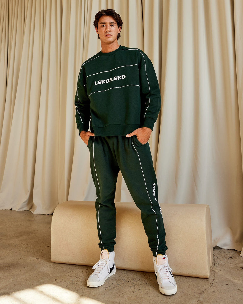 Model wearing Impact Trackpants - Forest