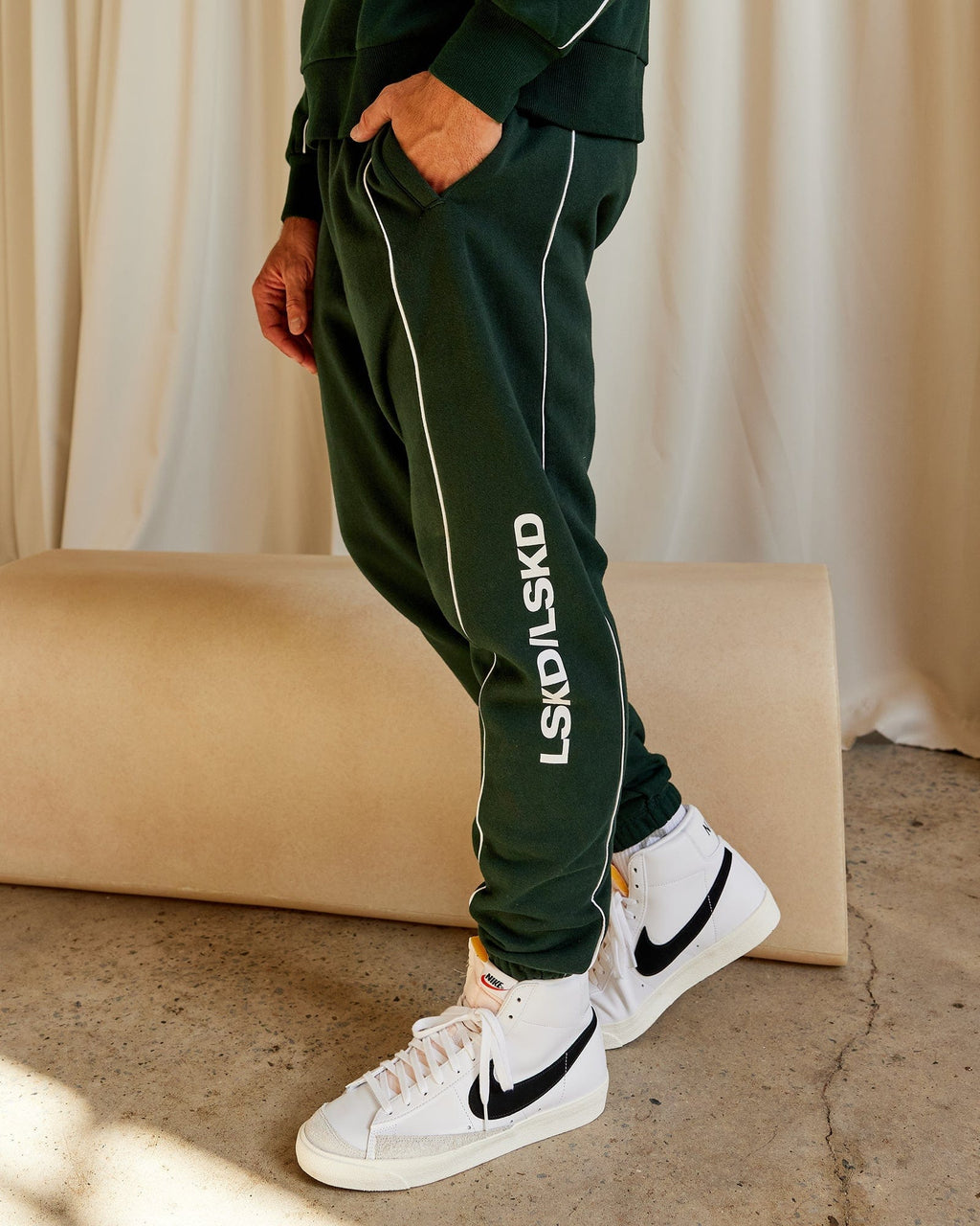 Model wearing Impact Trackpants - Forest