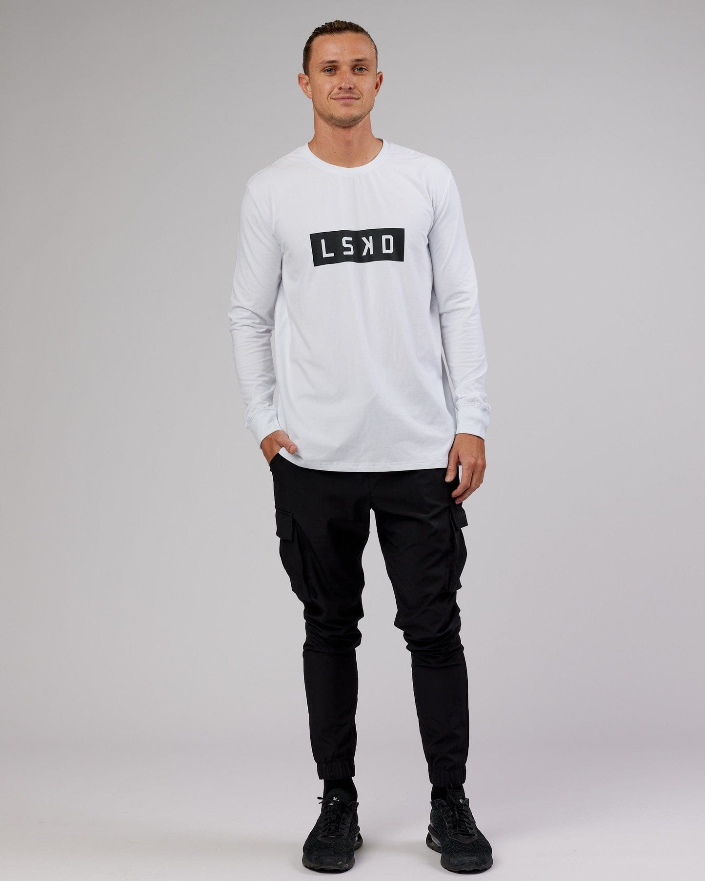 Model wearing Strength FLXCotton LS Tee - White-Black