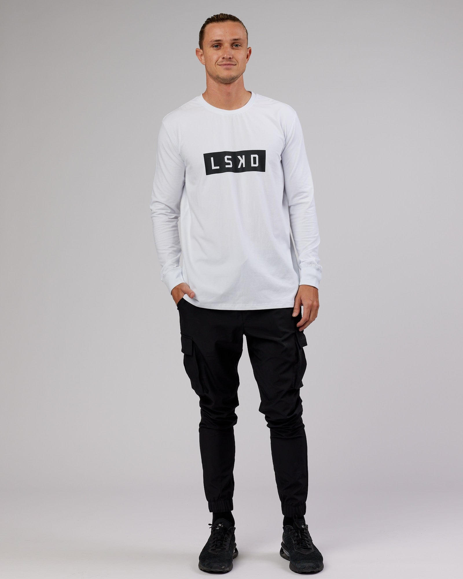 Model wearing Strength FLXCotton LS Tee - White-Black