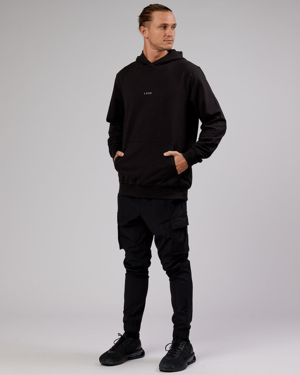 Model wearing Base Hoodie - Black