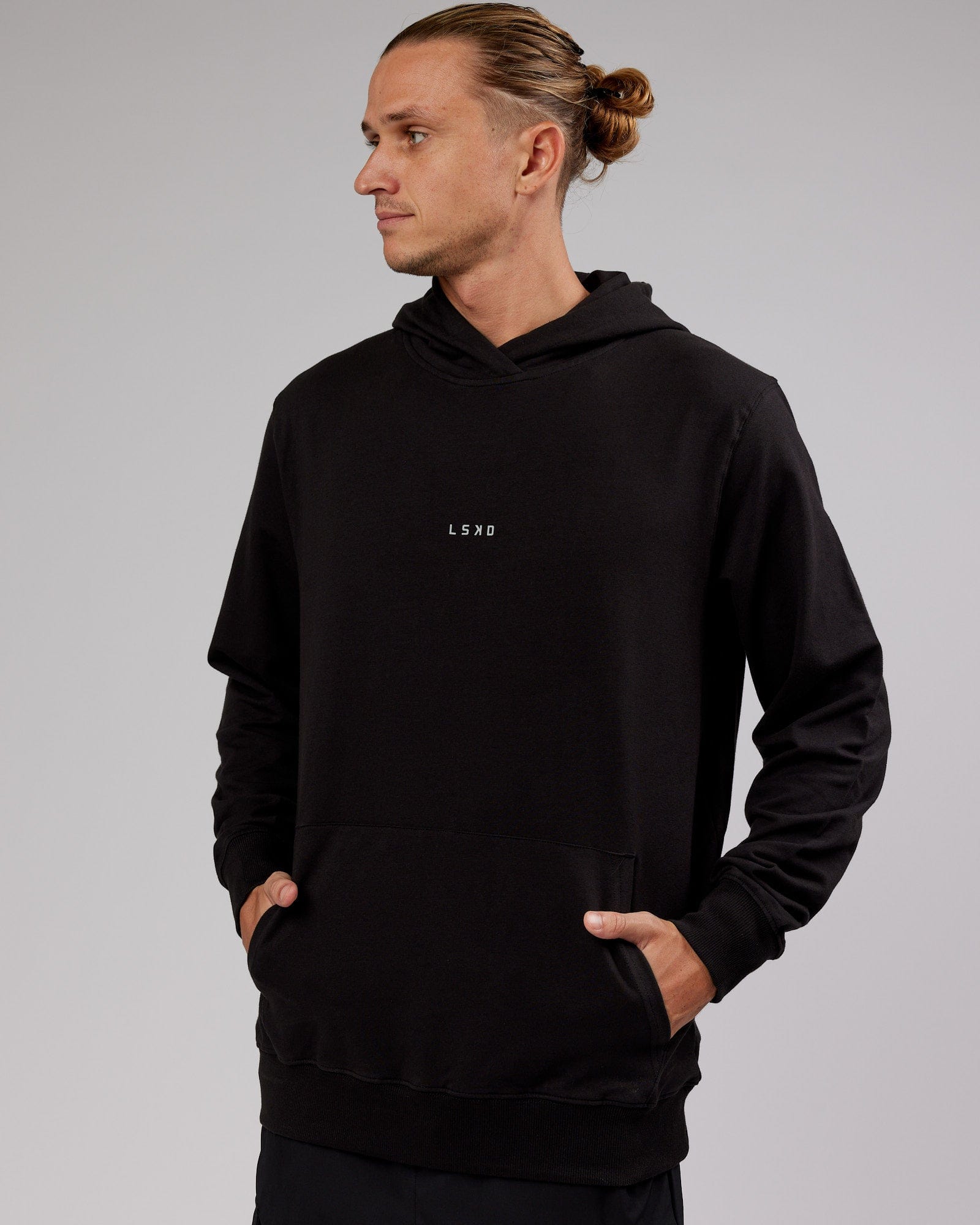 Model wearing Base Hoodie - Black