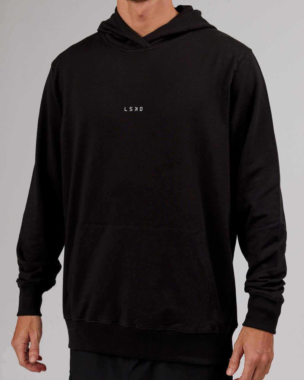 Model wearing Base Hoodie - Black