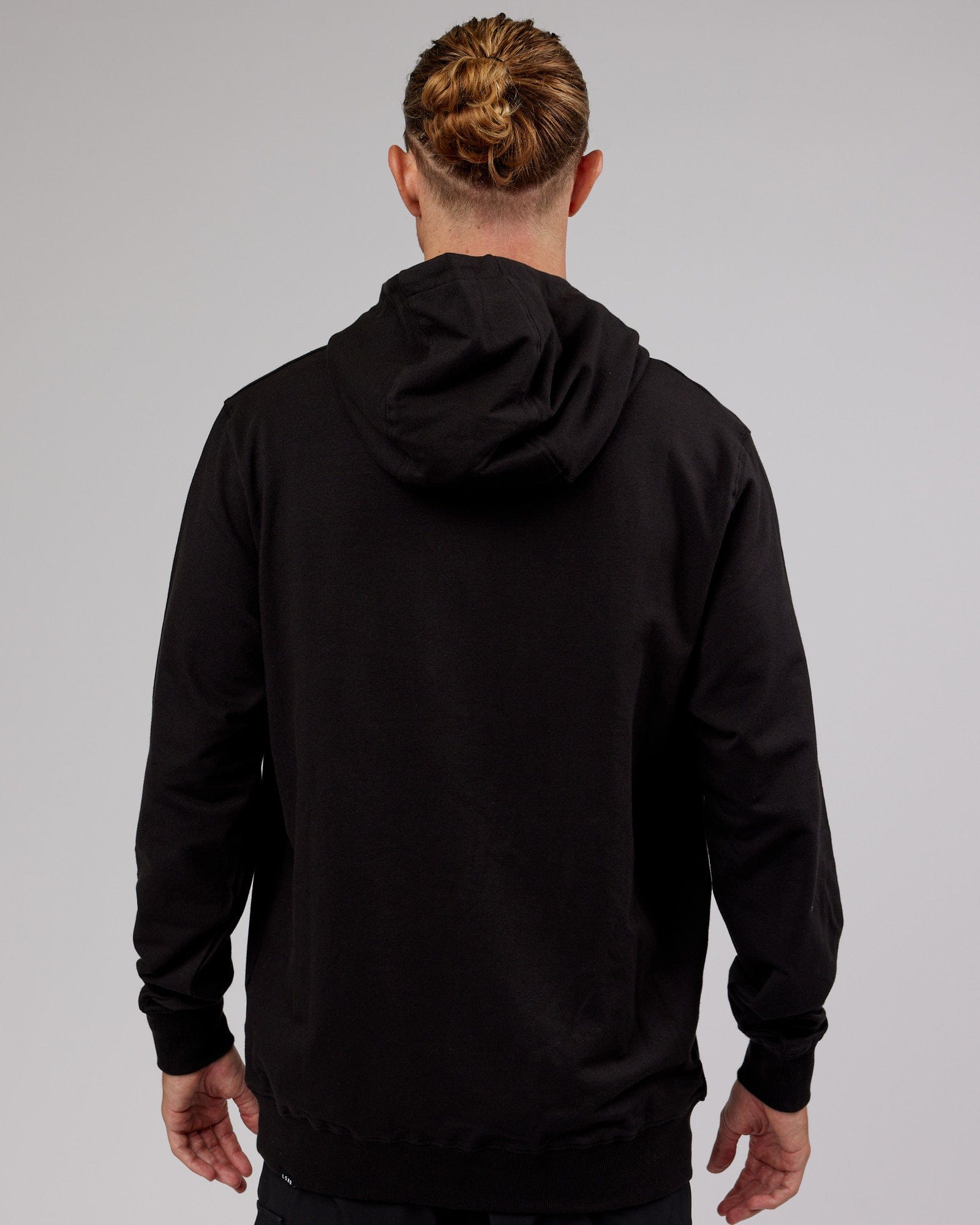 Model wearing Base Hoodie - Black