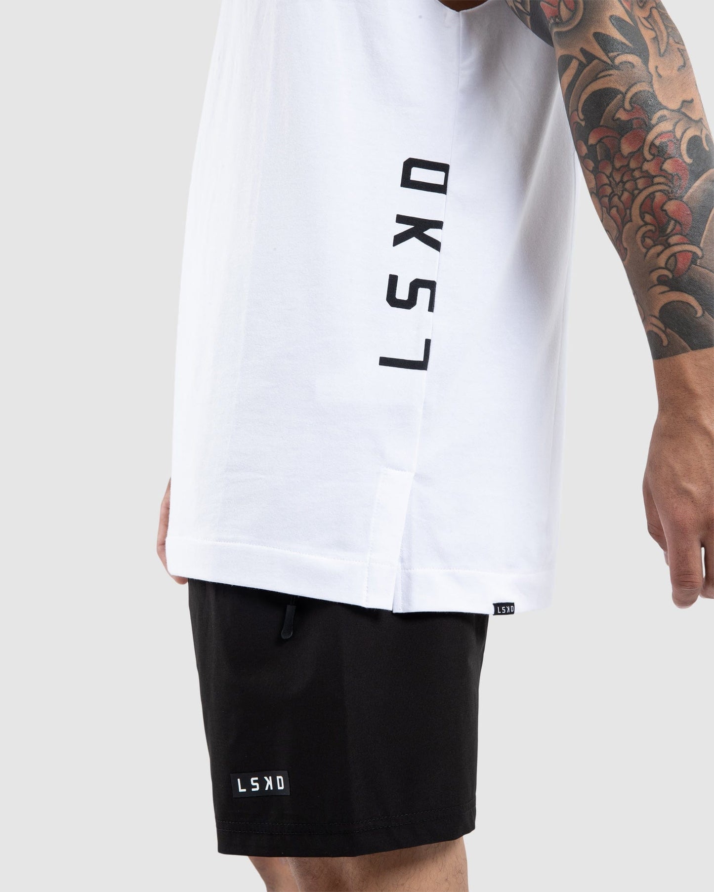 Model wearing Flex Tee - White