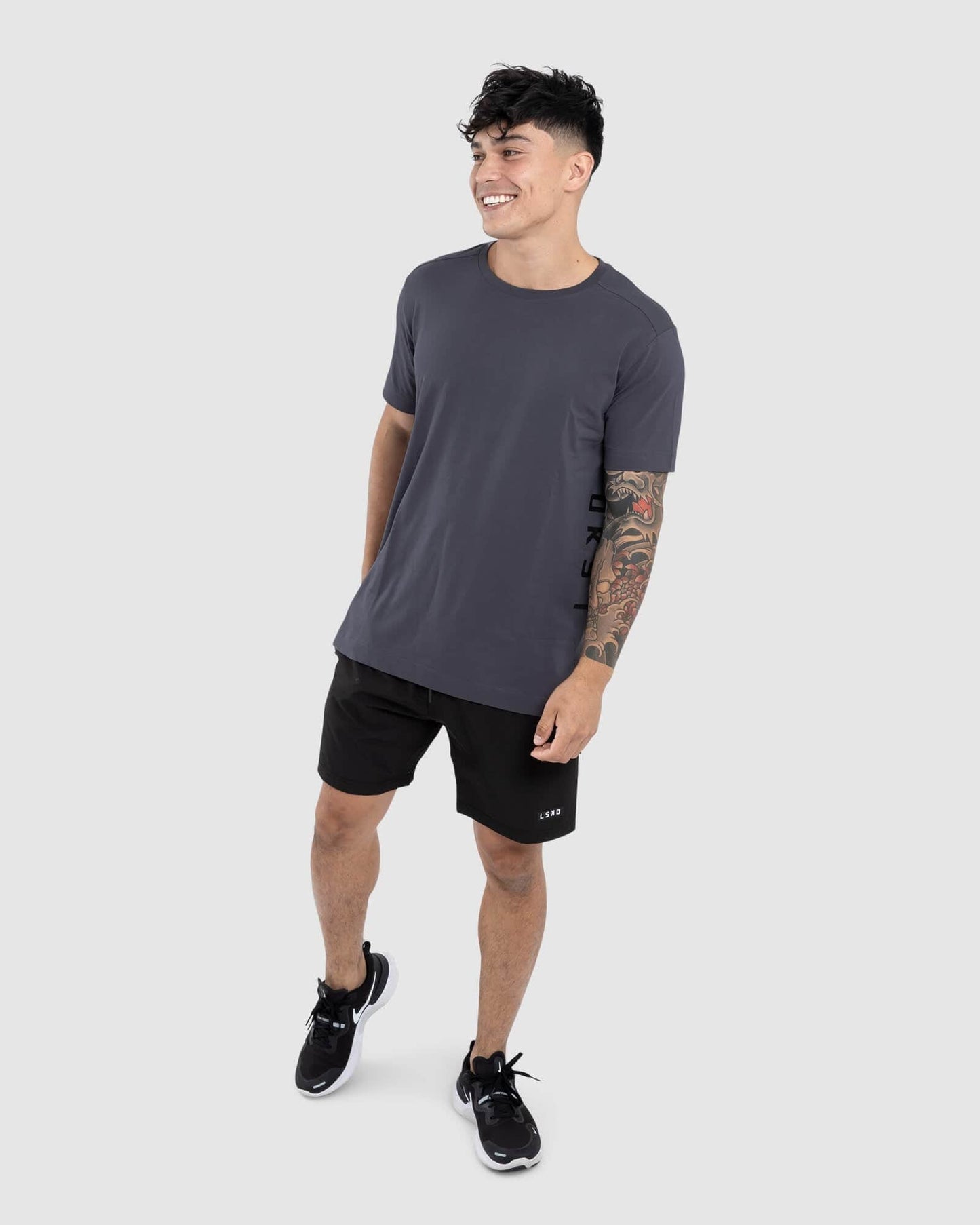 Model wearing Flex Tee - Iron