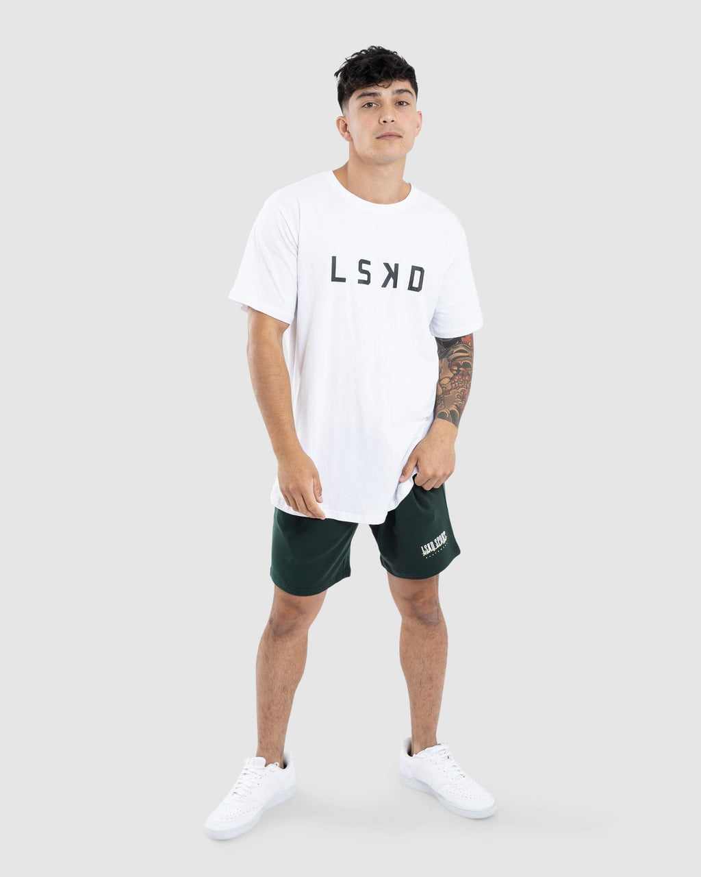 Model wearing Faculty Jersey Short - Vital Green