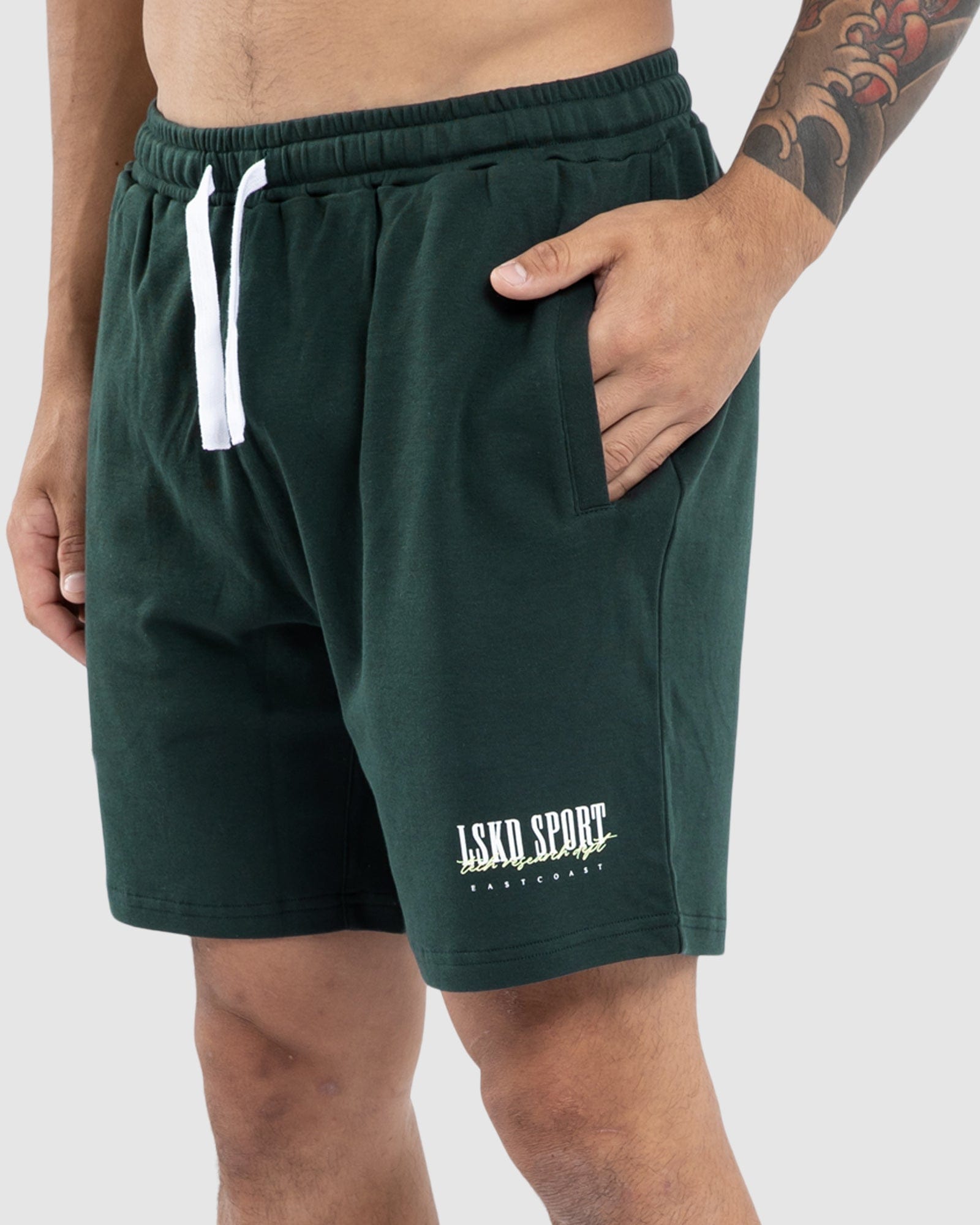 Model wearing Faculty Jersey Short - Vital Green