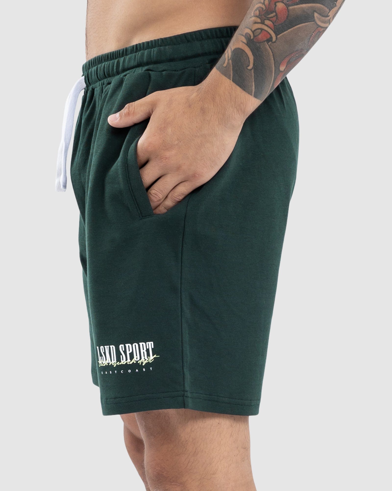 Model wearing Faculty Jersey Short - Vital Green