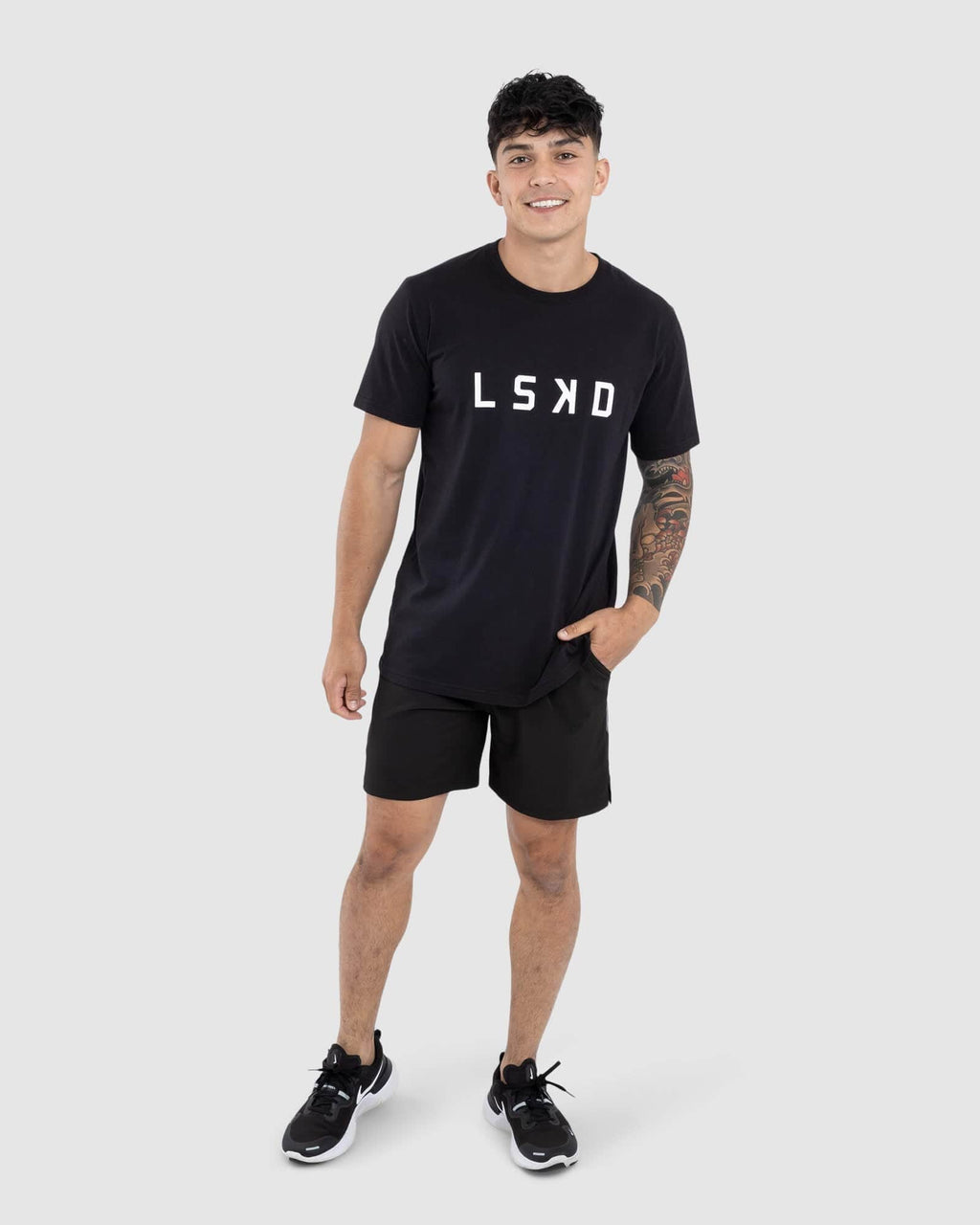 Model wearing Faction 7" Performance Short - Black-Black