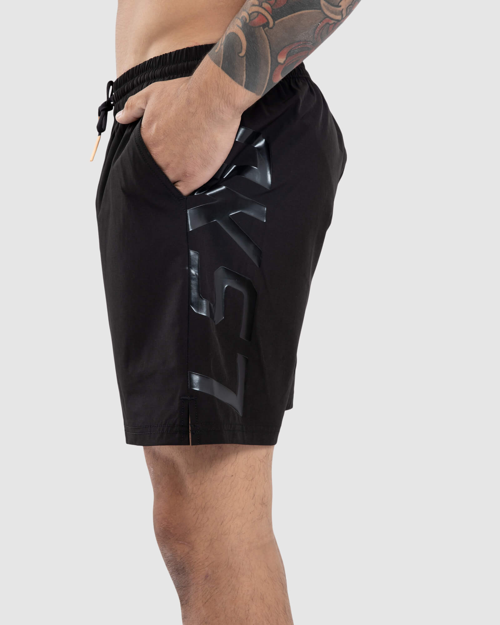 Model wearing Faction 7" Performance Short - Black-Black