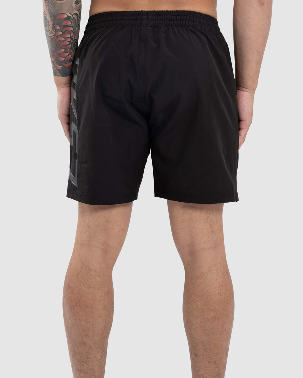 Model wearing Faction 7" Performance Short - Black-Black