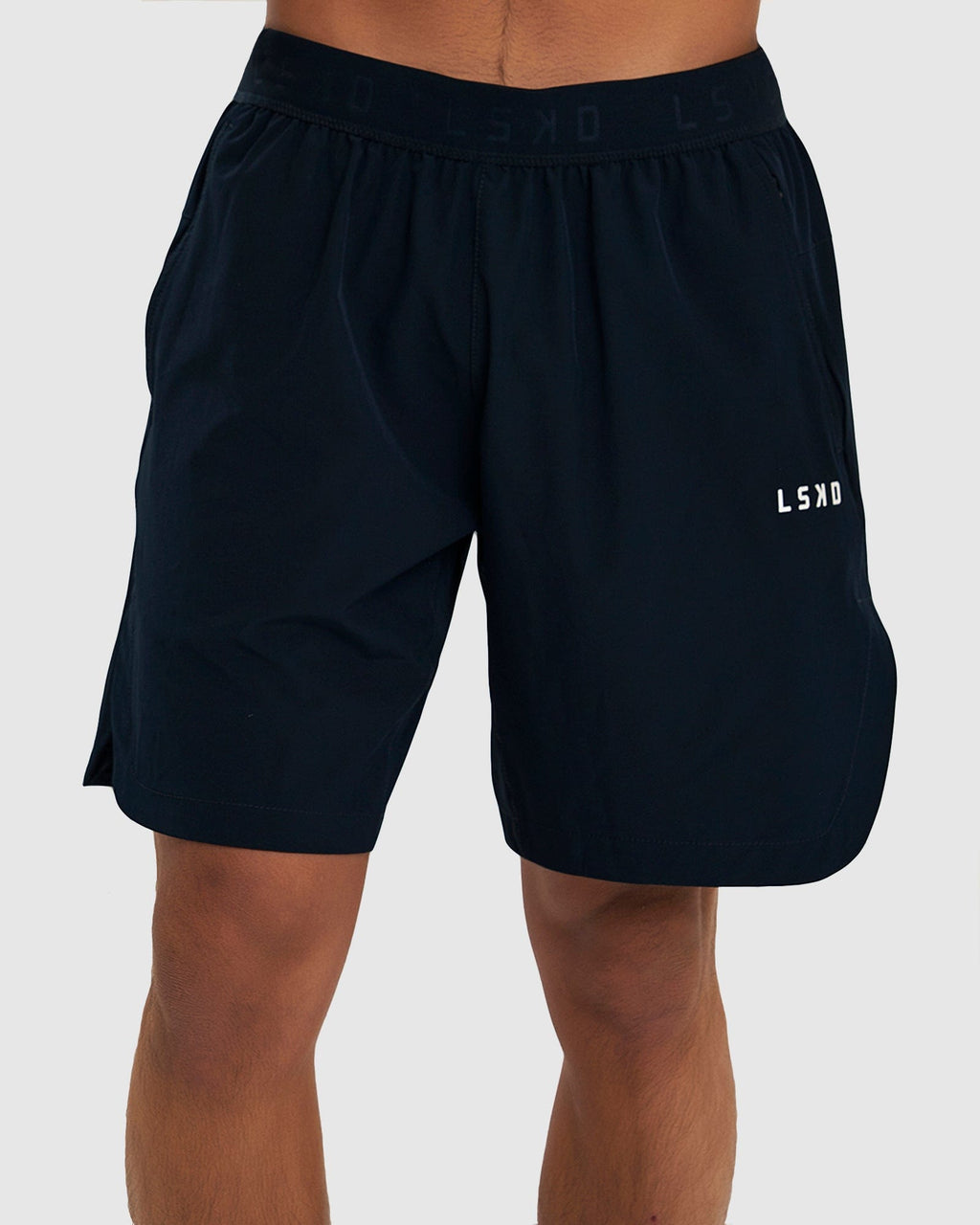 Model wearing Competition 8" Performance Short - Carbon