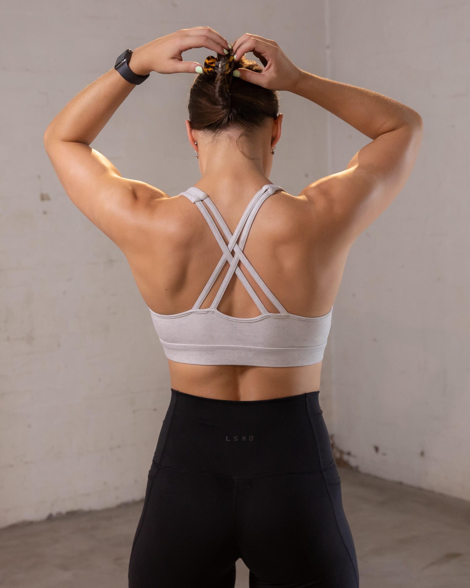 Model wearing Gisele Sports Bra - Lt Grey Marl