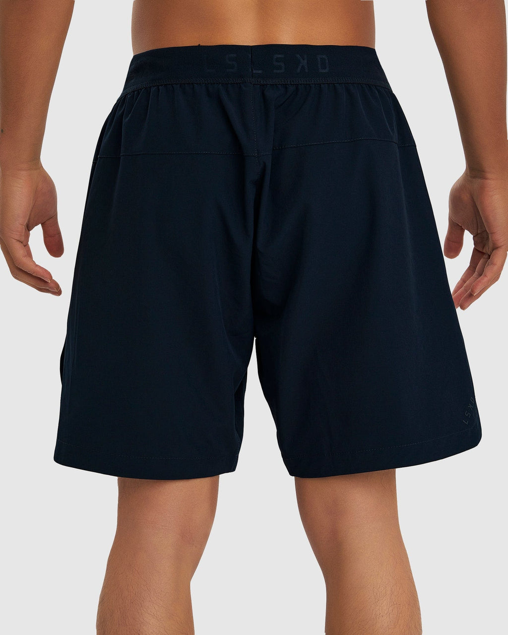 Model wearing Competition 8" Performance Short - Carbon