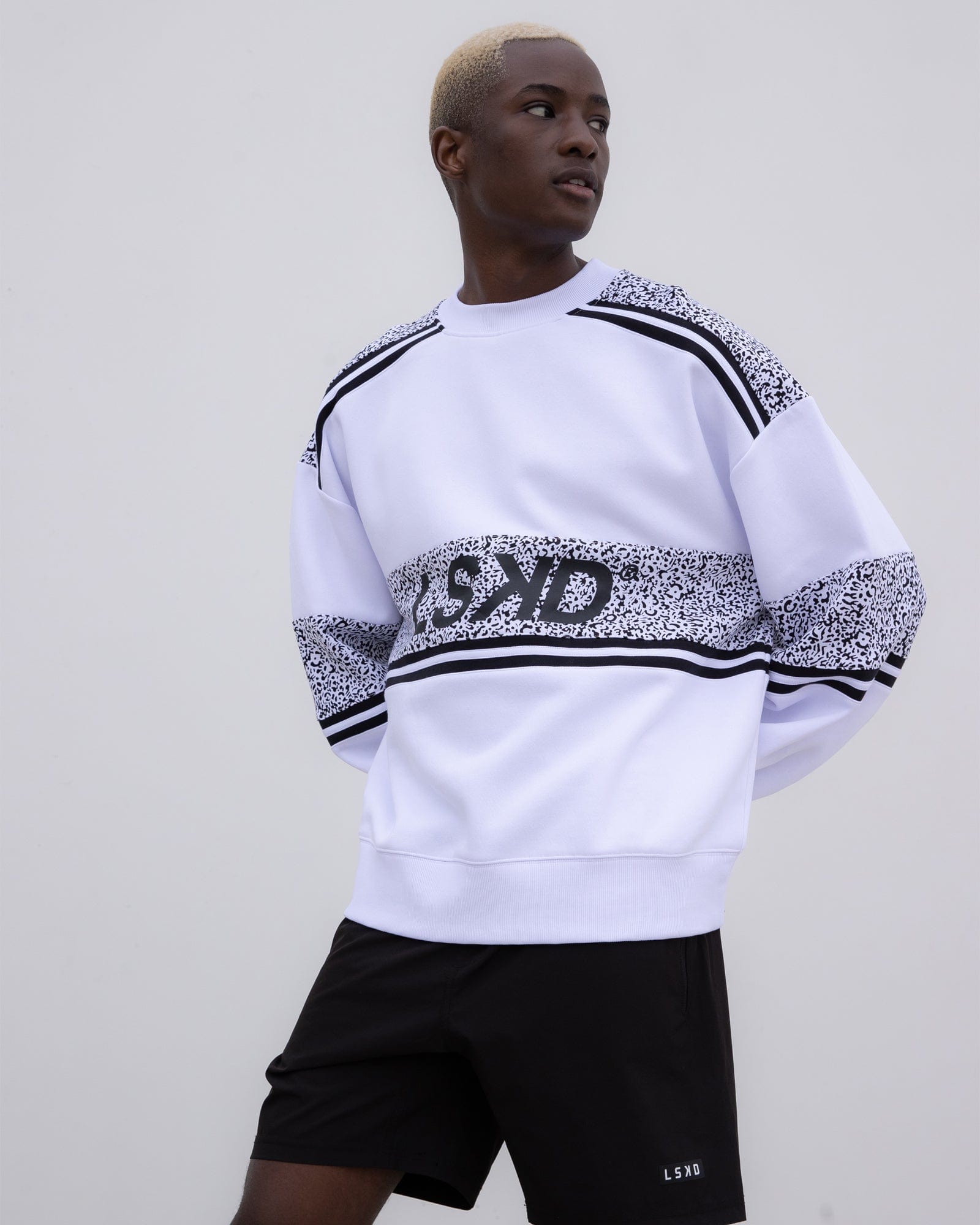 Model wearing Unisex A-Team Oversize Sweater - Spotty White-Black