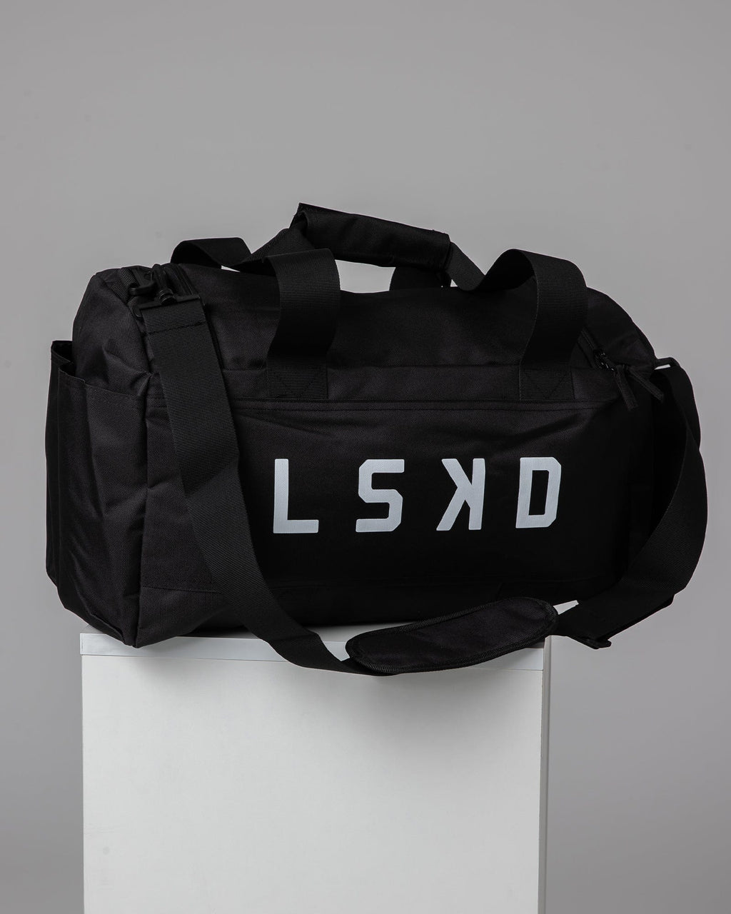 Model wearing Essential Duffle Bag Gift - Black