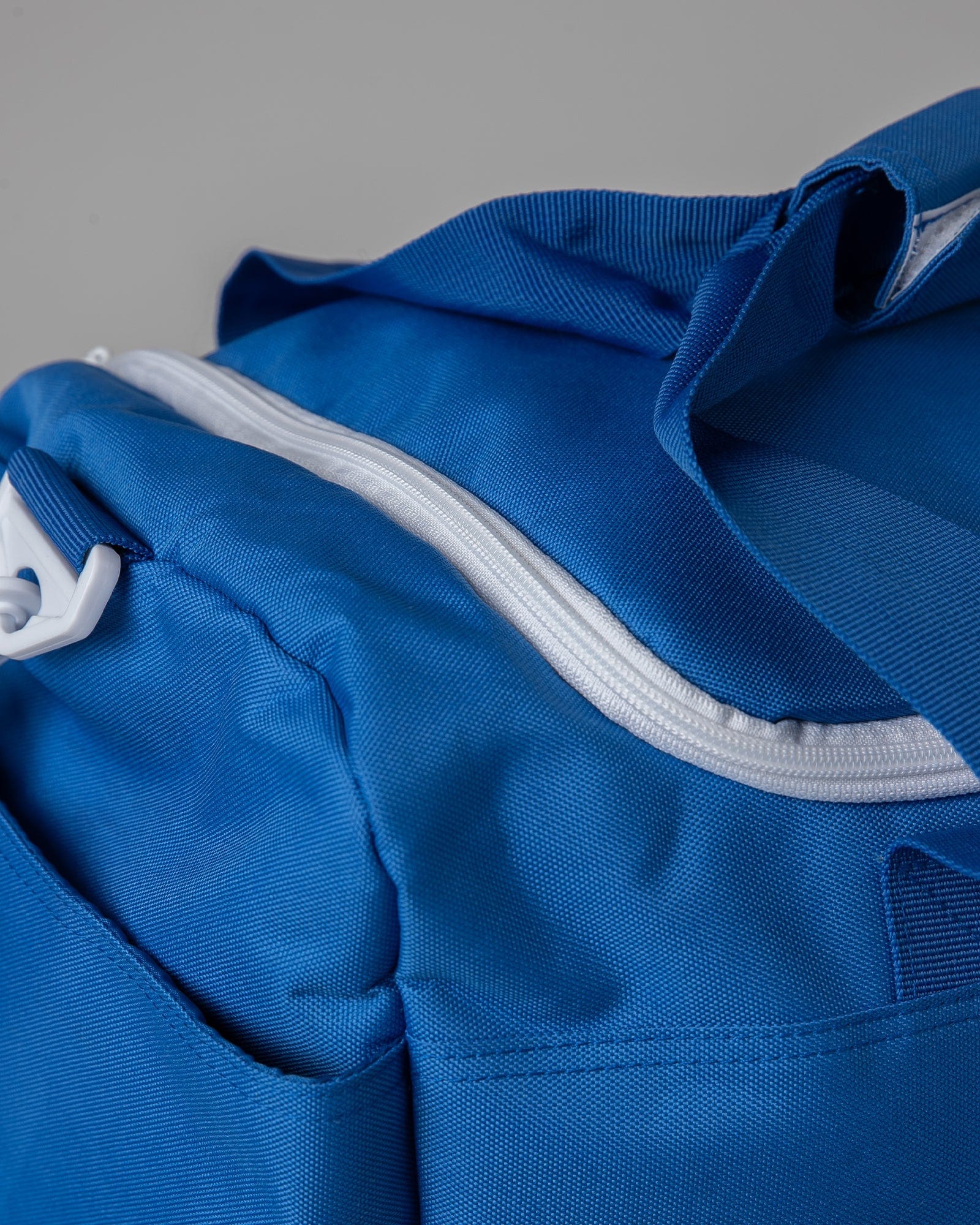 Model wearing Essential Duffle Bag - Turkish Sea