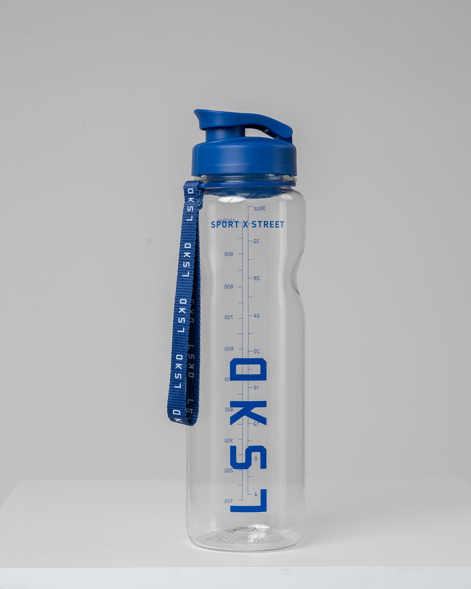 Model wearing Rep 1L Plastic Bottle - Turkish Sea-Clear