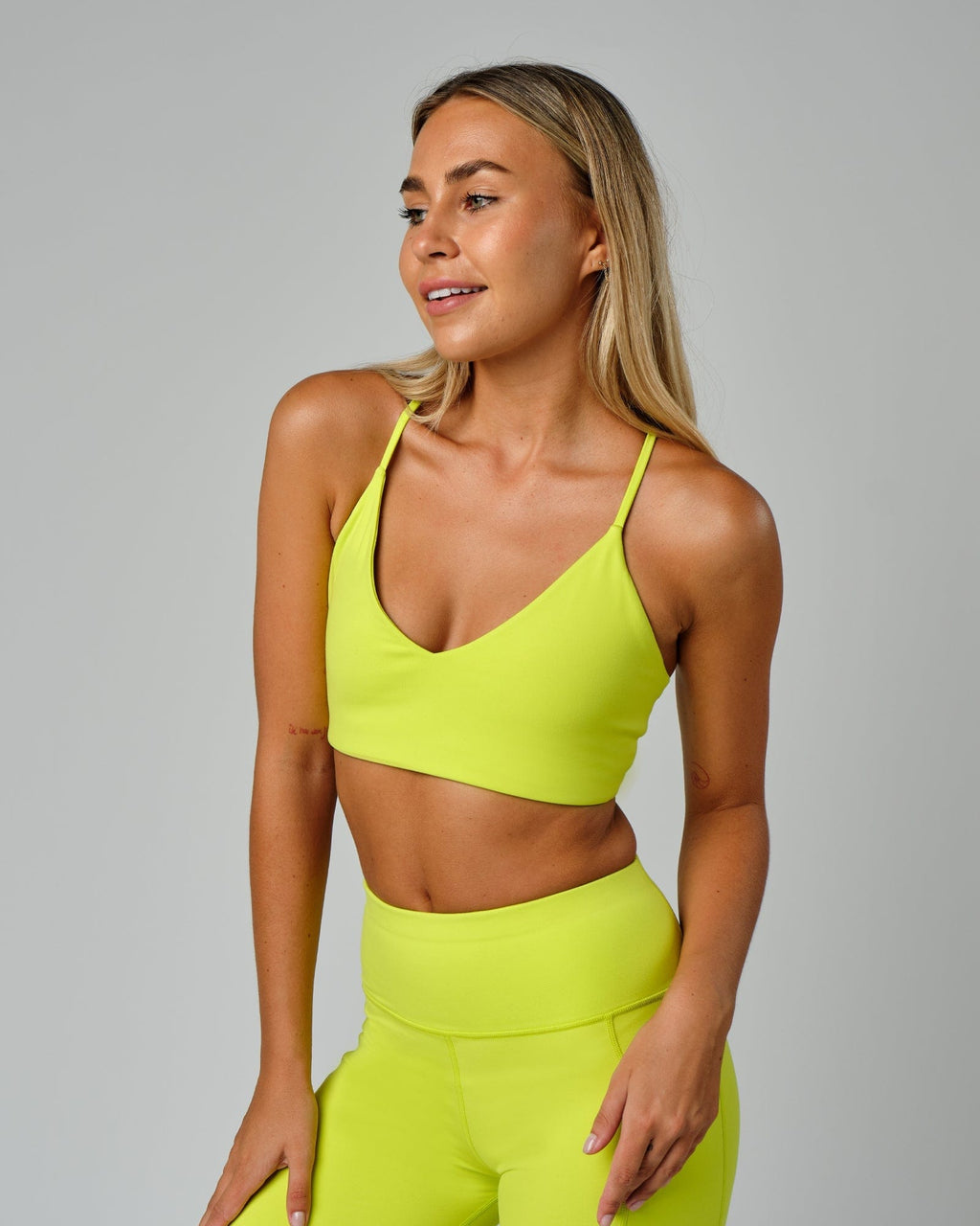 Model wearing Form Sports Bra - Fluro Lime