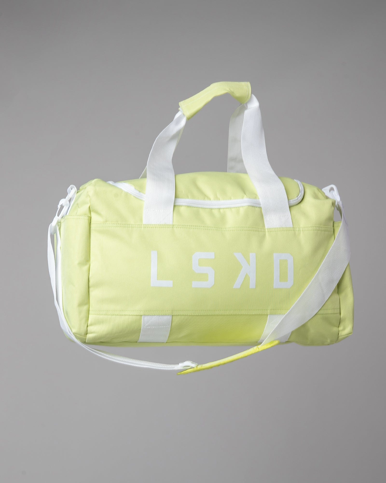 Model wearing Essential Duffle Bag - Pastel Lime