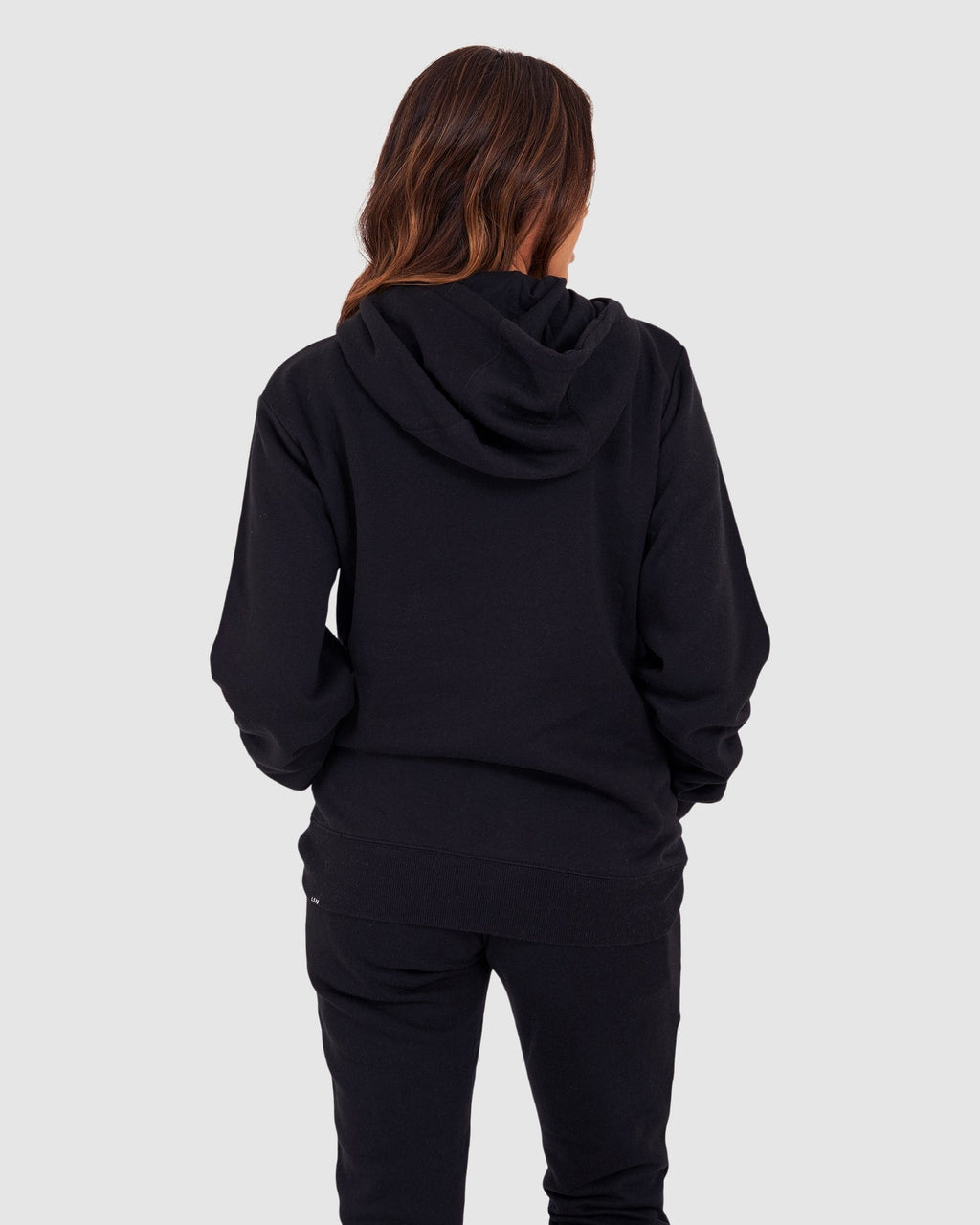 Model wearing Unisex Structure Hoodie - Black