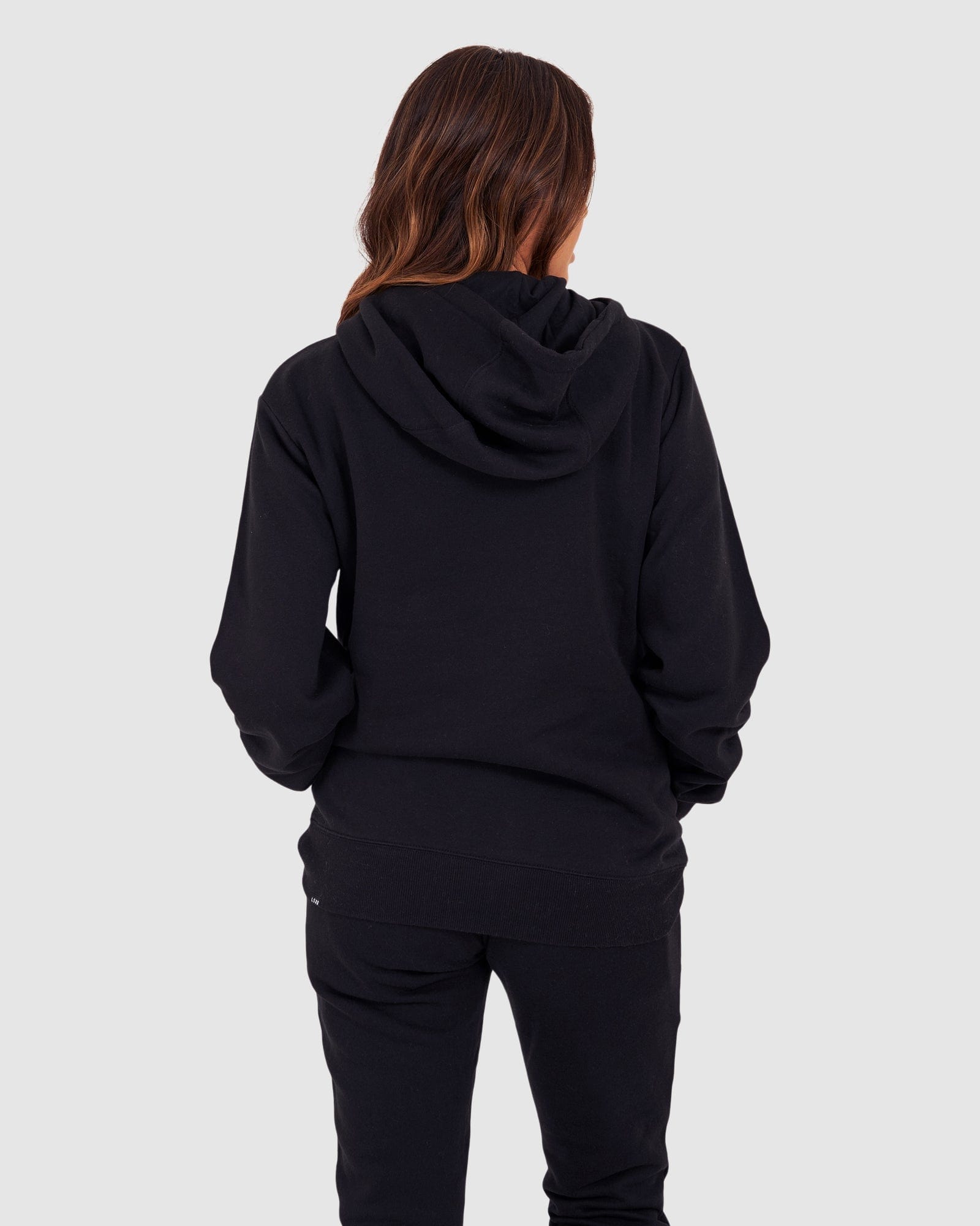 Model wearing Unisex Structure Hoodie - Black