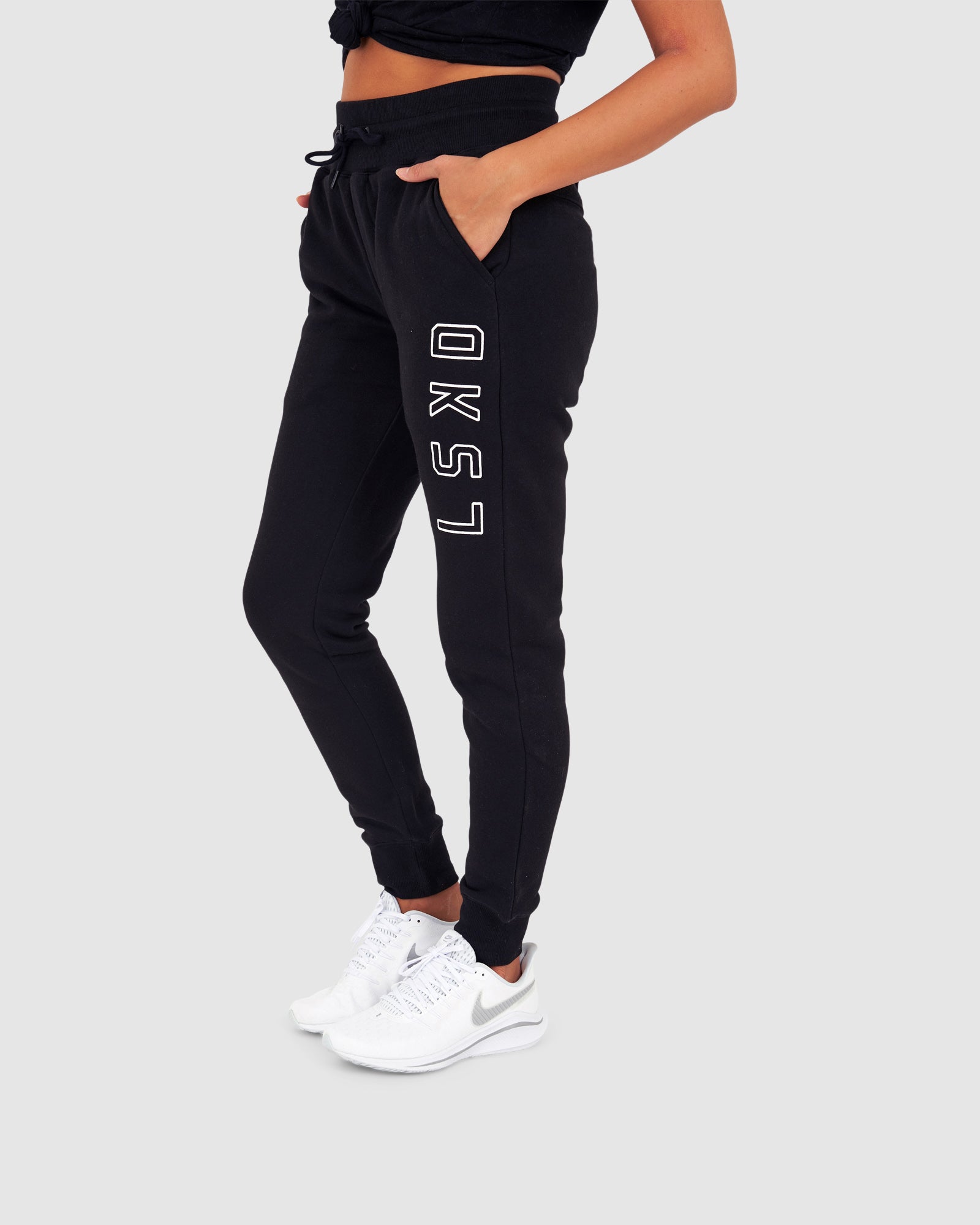 Model wearing Unisex Tidy Trackpant - Black