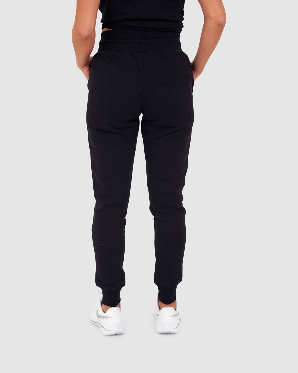 Model wearing Unisex Tidy Trackpant - Black