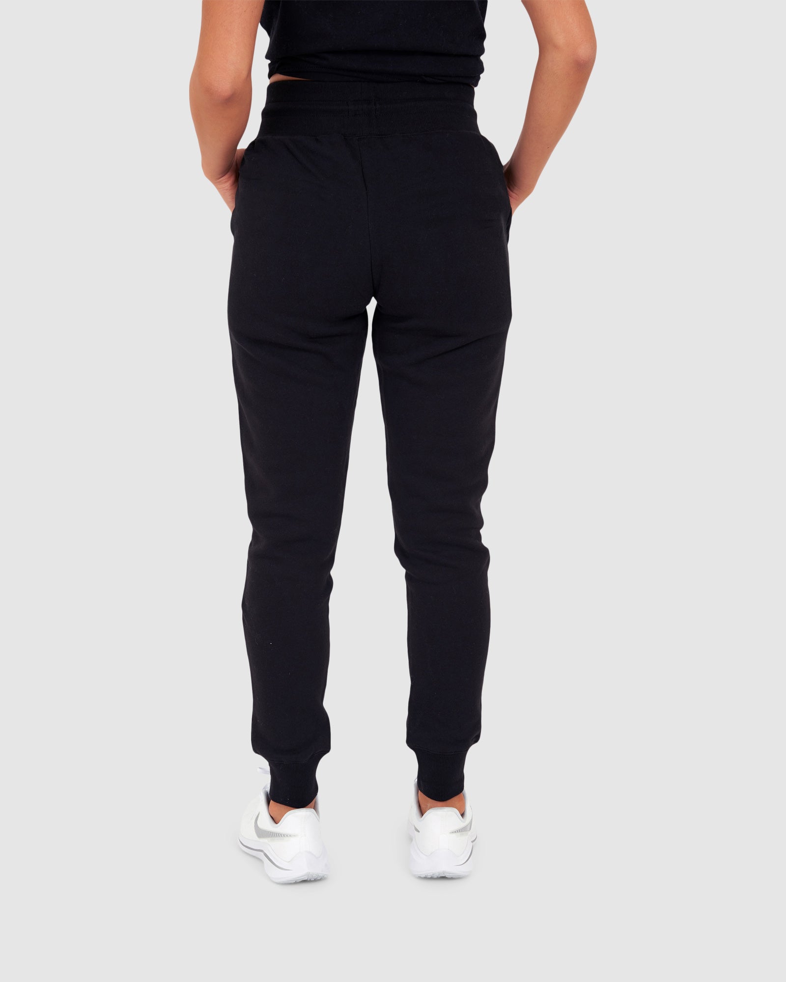 Model wearing Unisex Tidy Trackpant - Black
