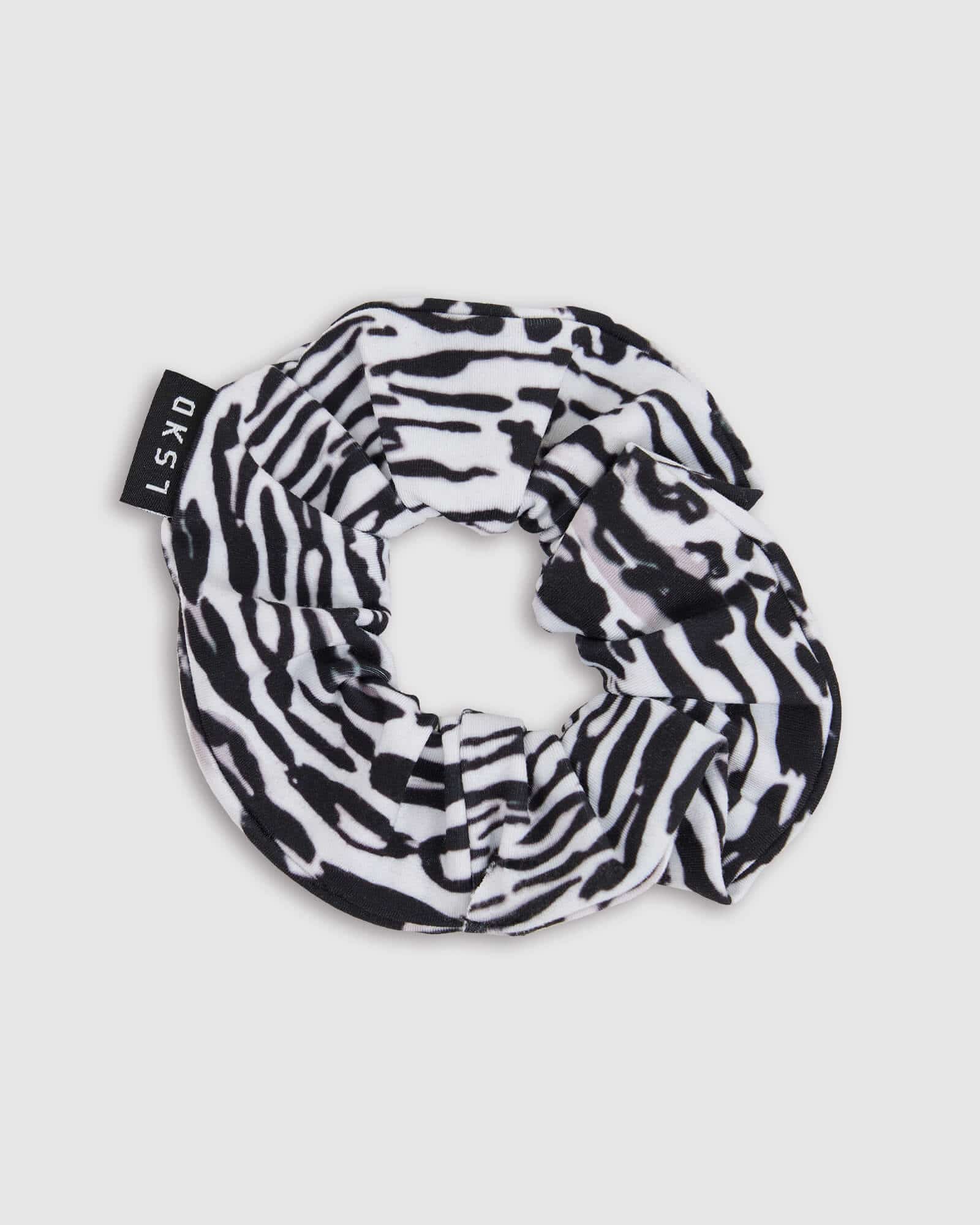 Model wearing Rep Scrunchie - Snow Leopard