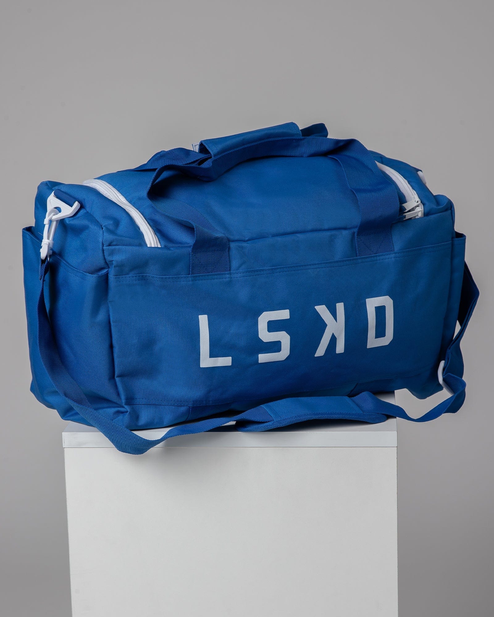 Model wearing Essential Duffle Bag - Turkish Sea