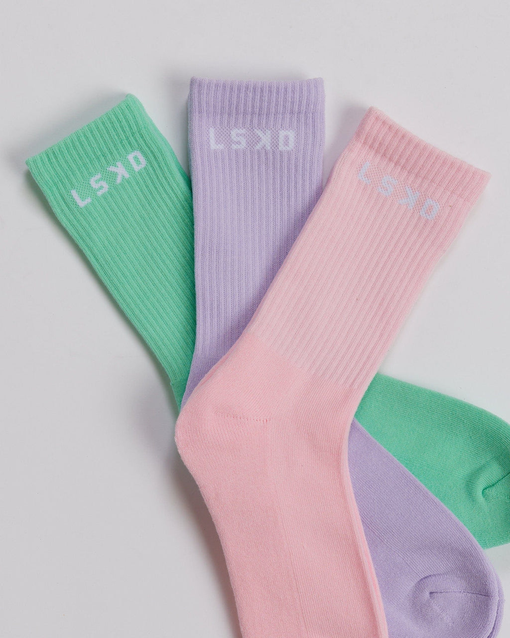 Model wearing Daily 3 Pack Crew Sock - Pink/Purple/Green
