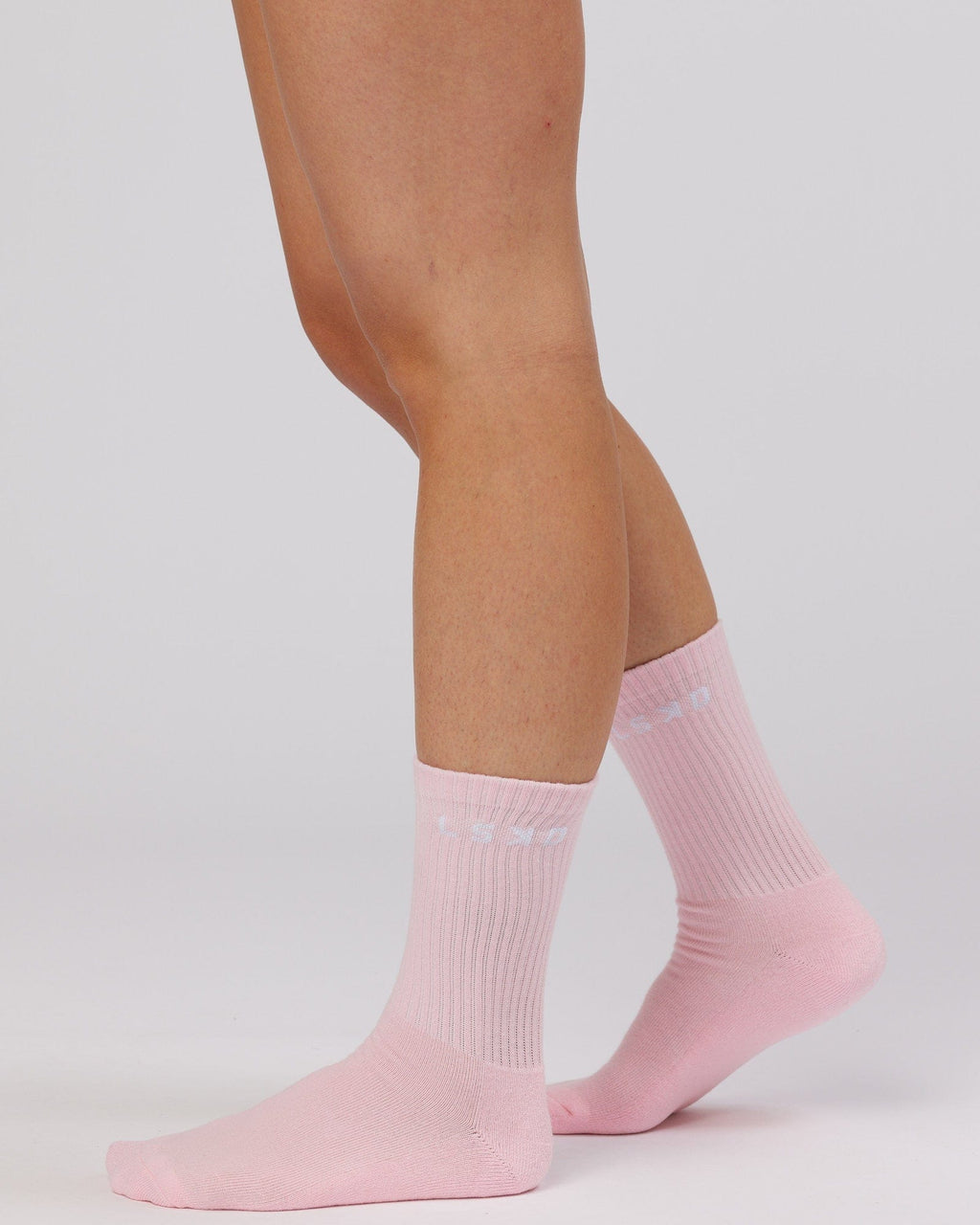 Model wearing Daily 3 Pack Crew Sock - Pink/Purple/Green