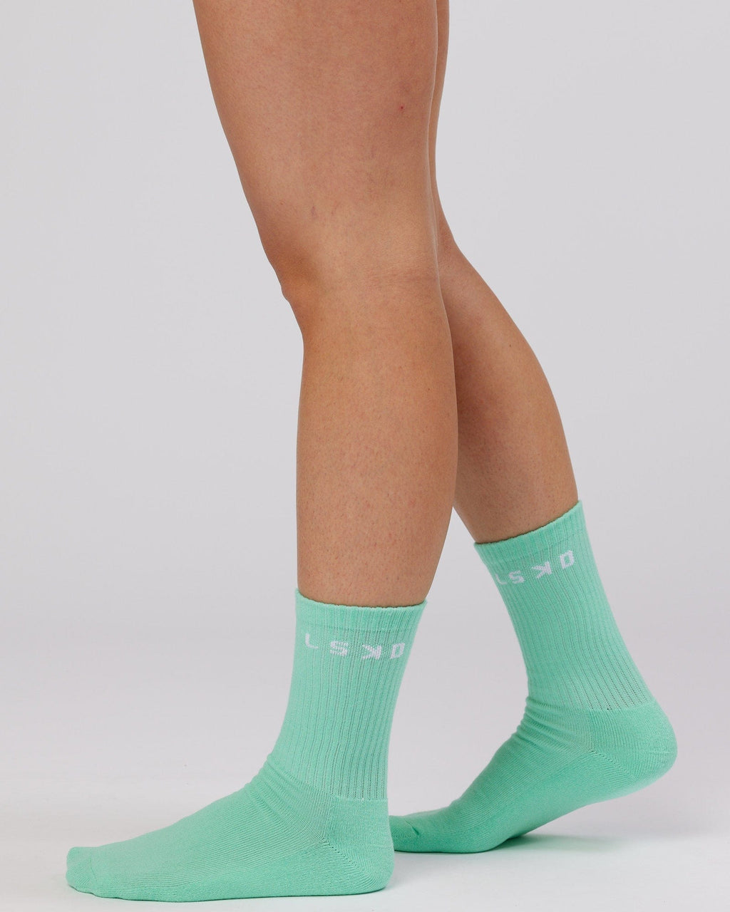 Model wearing Daily 3 Pack Crew Sock - Pink/Purple/Green