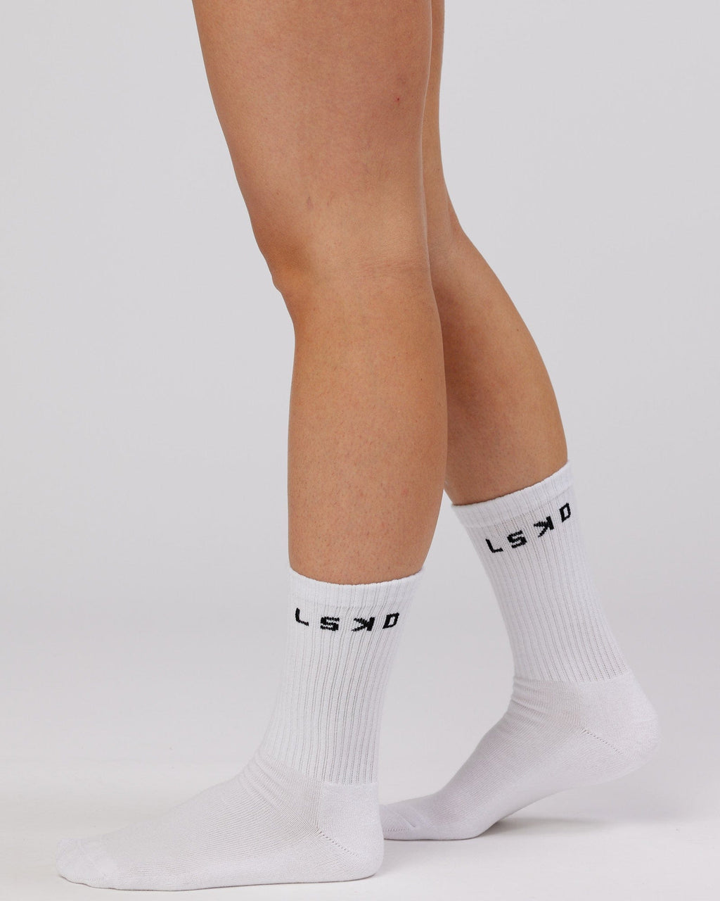 Model wearing Daily 3 Pack Crew Sock - Black/Grey/White
