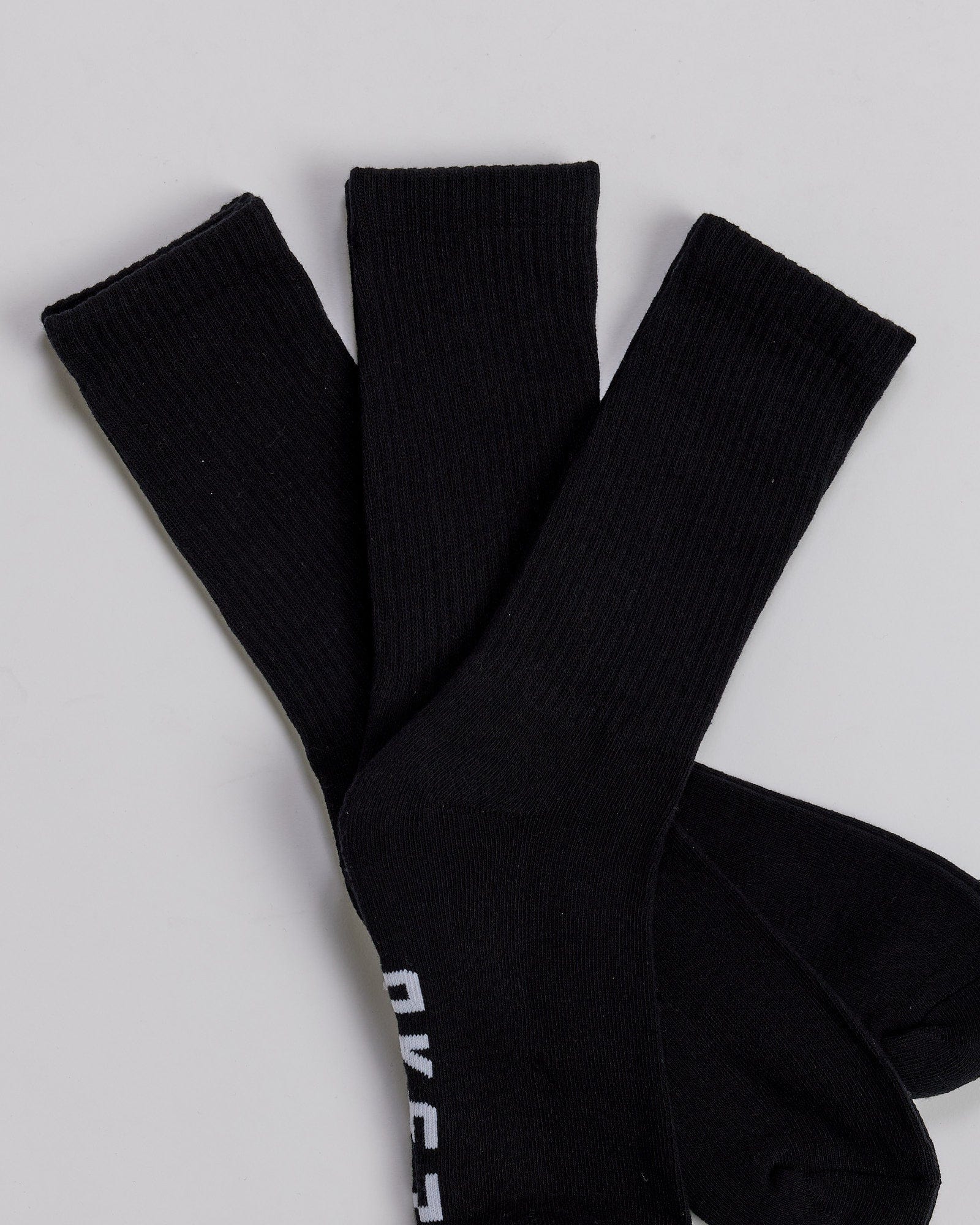 Model wearing Essential 3 Pack Crew Sock - Black