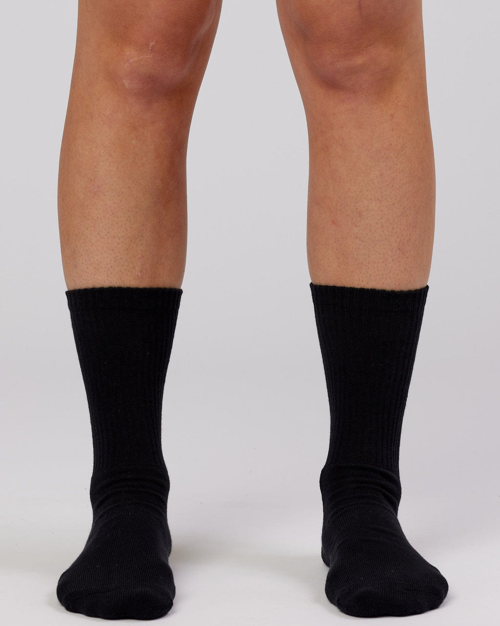 Model wearing Essential 3 Pack Crew Sock - Black