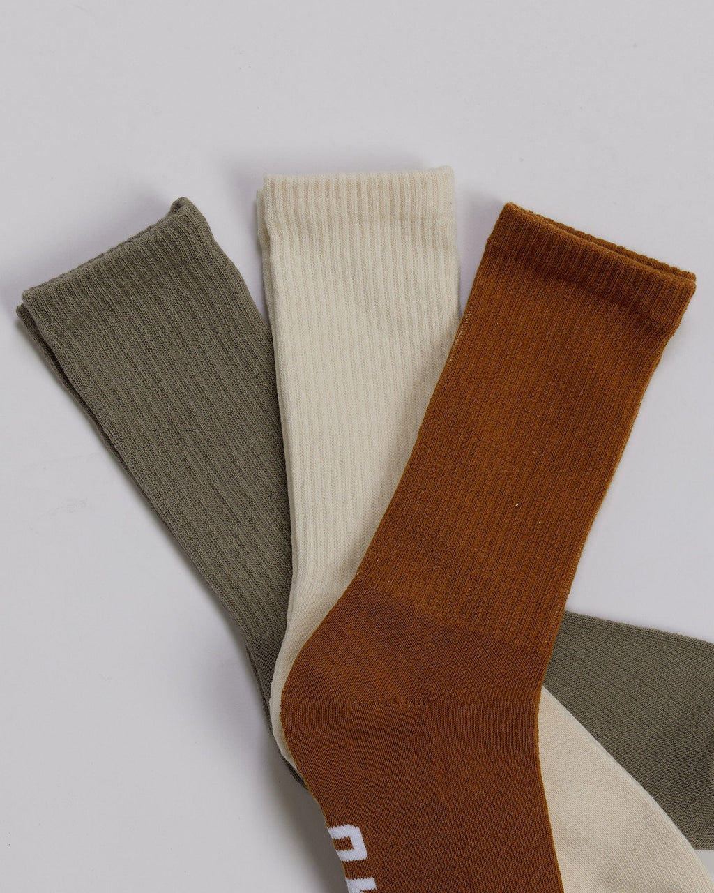 Model wearing Essential 3 Pack Crew Sock - Khaki/Cream/Red