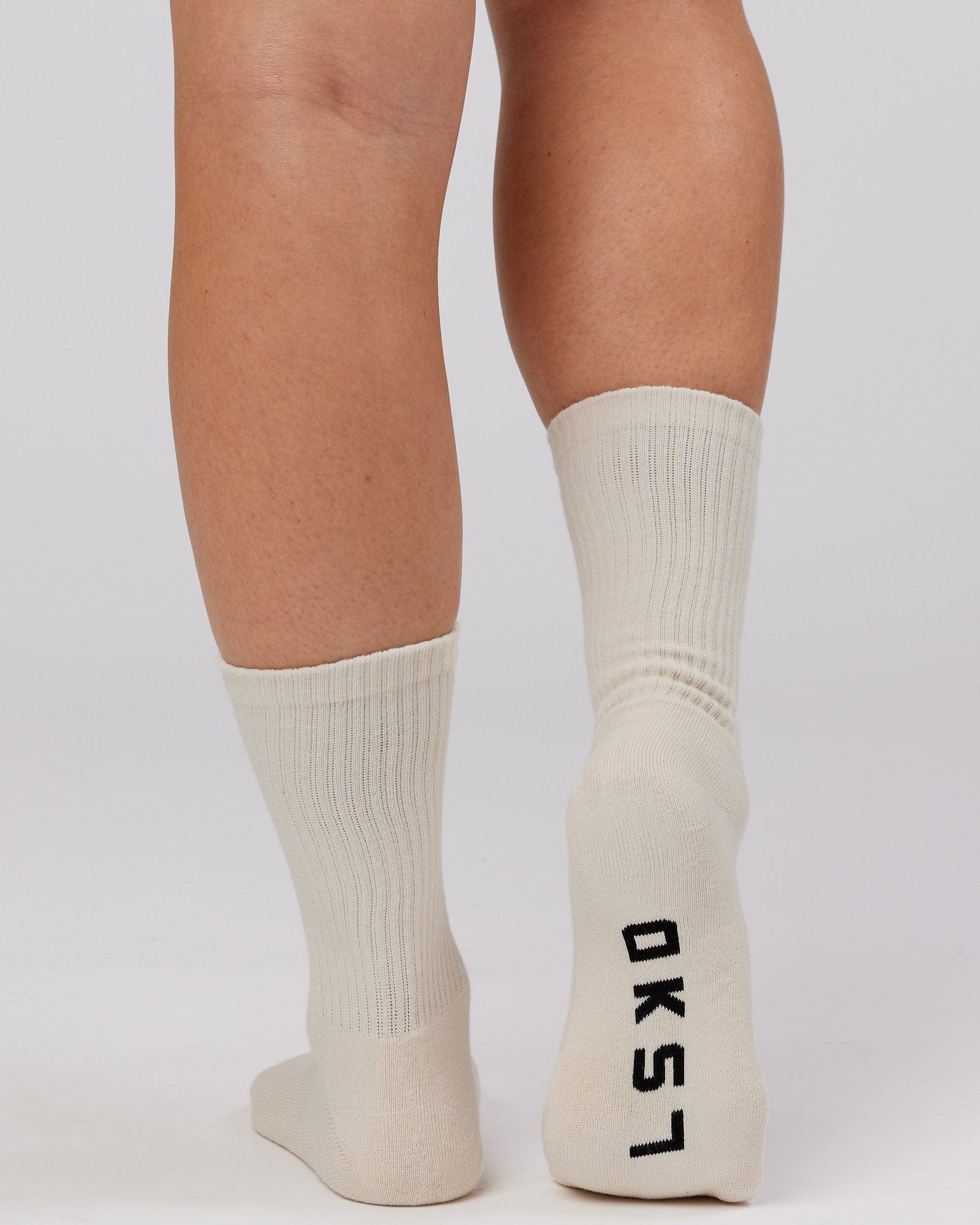 Model wearing Essential 3 Pack Crew Sock - Khaki/Cream/Red