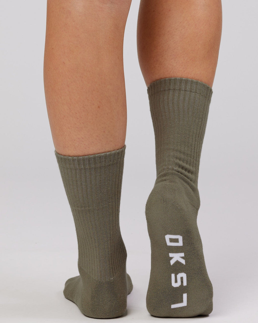 Model wearing Essential 3 Pack Crew Sock - Khaki/Cream/Red