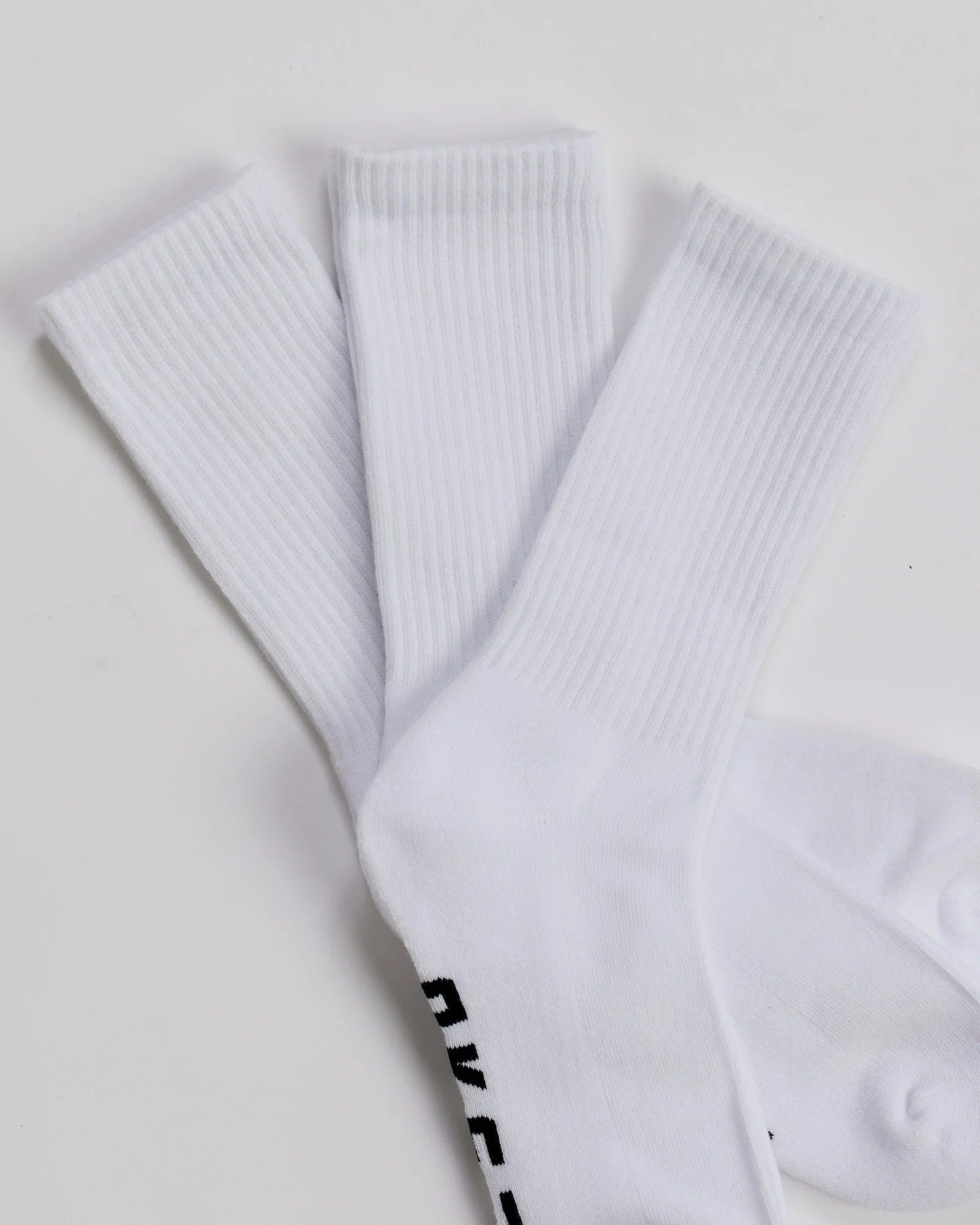 Model wearing Essential 3 Pack Crew Sock Gift - White